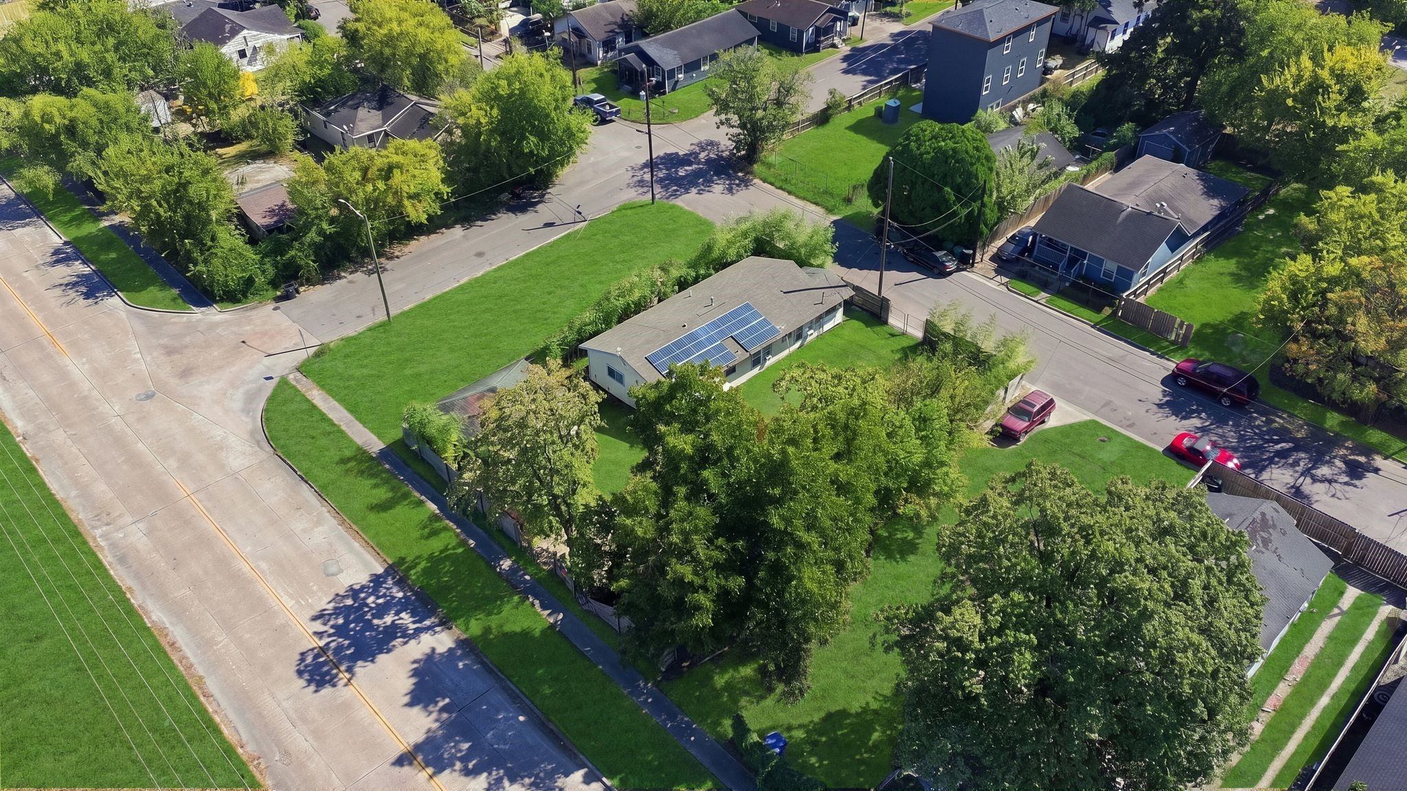 Aerial view highlights the established neighborhood surrounding the property.