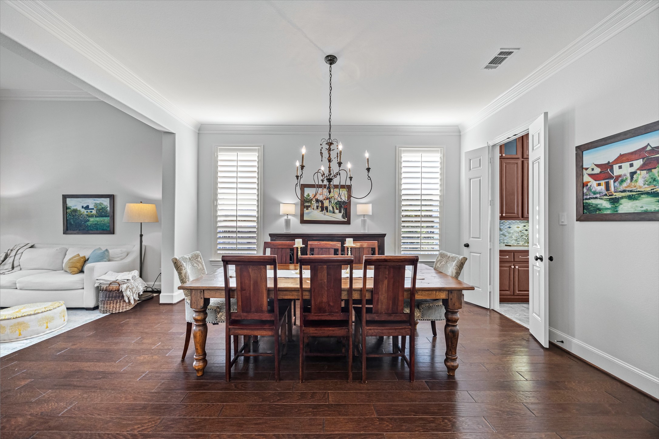Formal dining room flowing seamlessly into adjoining living spaces. All new lighting on dimmers. Updated paint throughout.