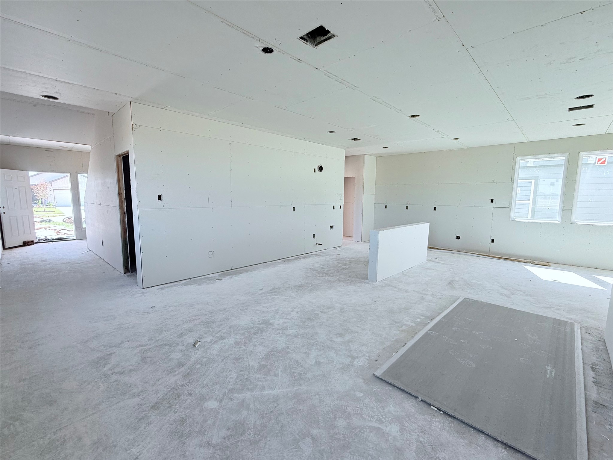 Living room into kitchen and foyer