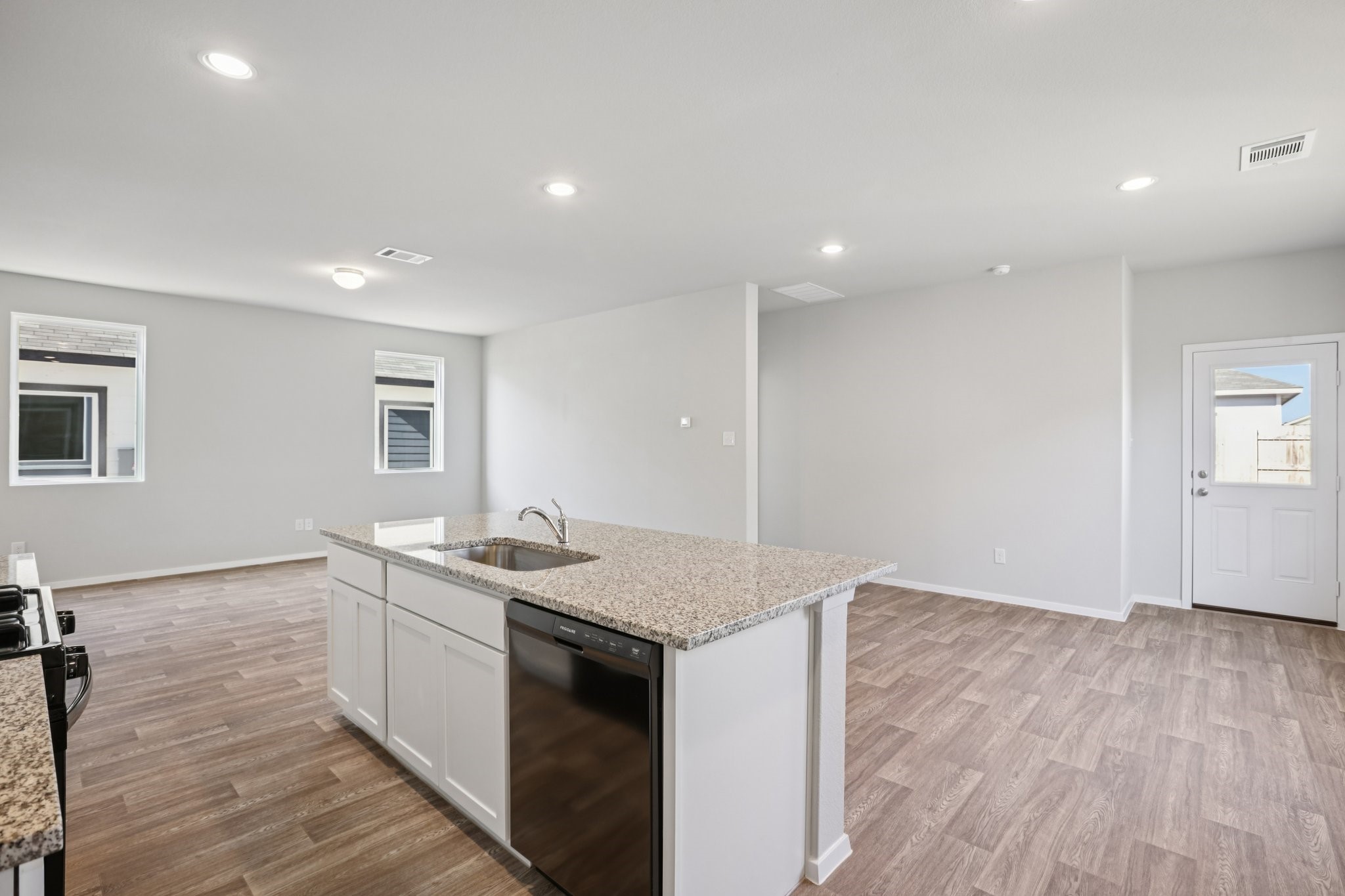 Kitchen into dining and living room representative photo