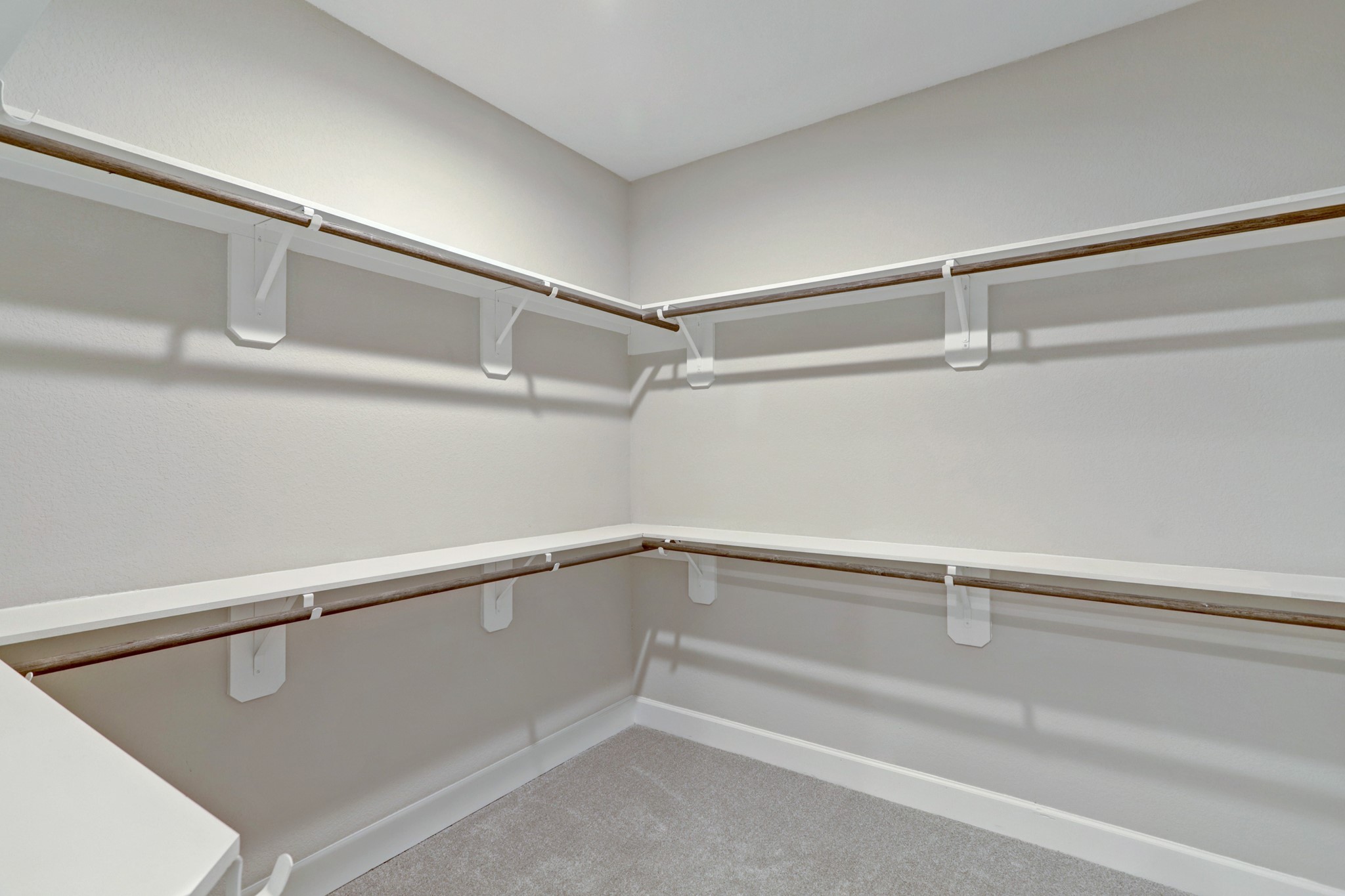 Oversized walk in closet offers ample space