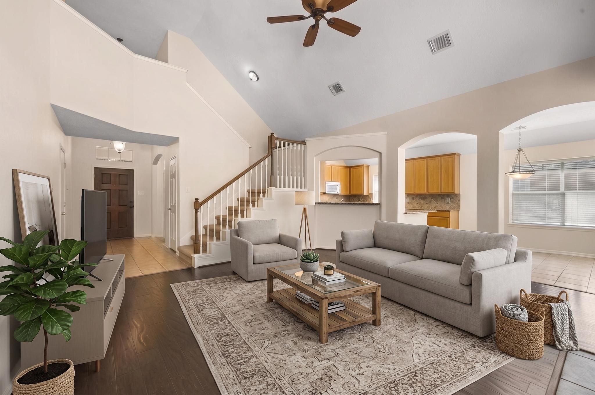 Soaring ceilings in the living room, and tons of windows for natural light (Virtually staged). Soaring ceilings in the living room, and tons of windows for natural light (Virtually staged).