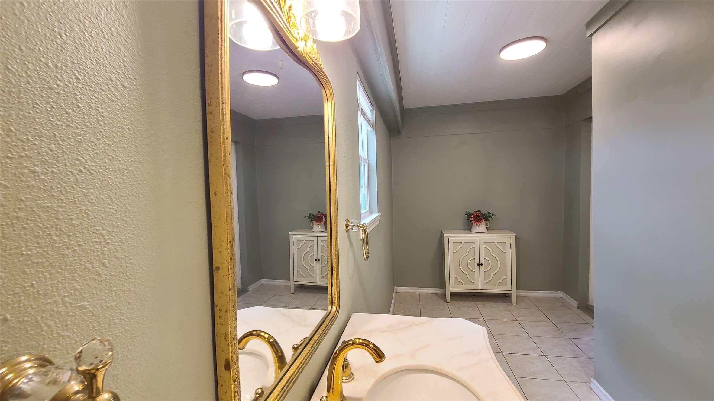 Full bath vanity is behind family room