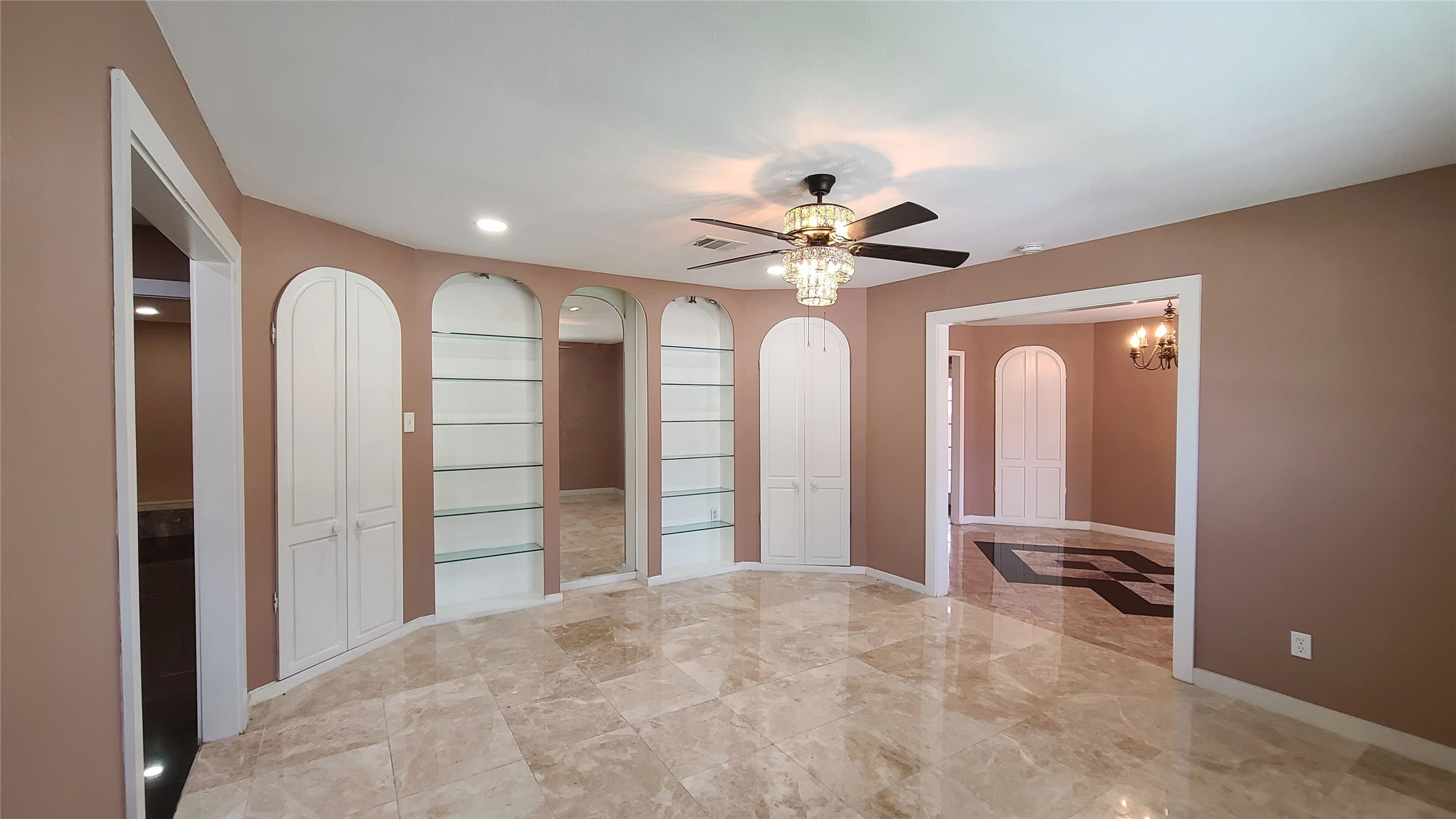 Spacious driveway leads to a charming covered patio, perfect for entertaining, with seamless indoor flow where the living room is conveniently adjacent to the formal dining area.