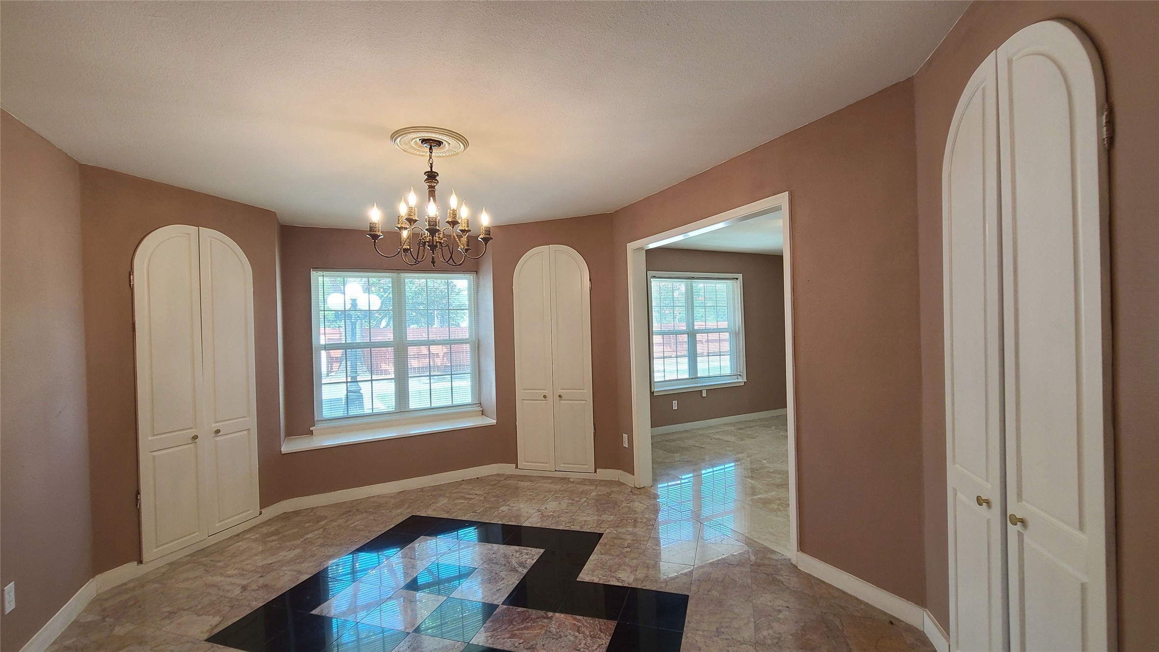 Elegant formal dining room featuring four corner butler pantries, ideal for seamless entertaining and sophisticated gatherings.