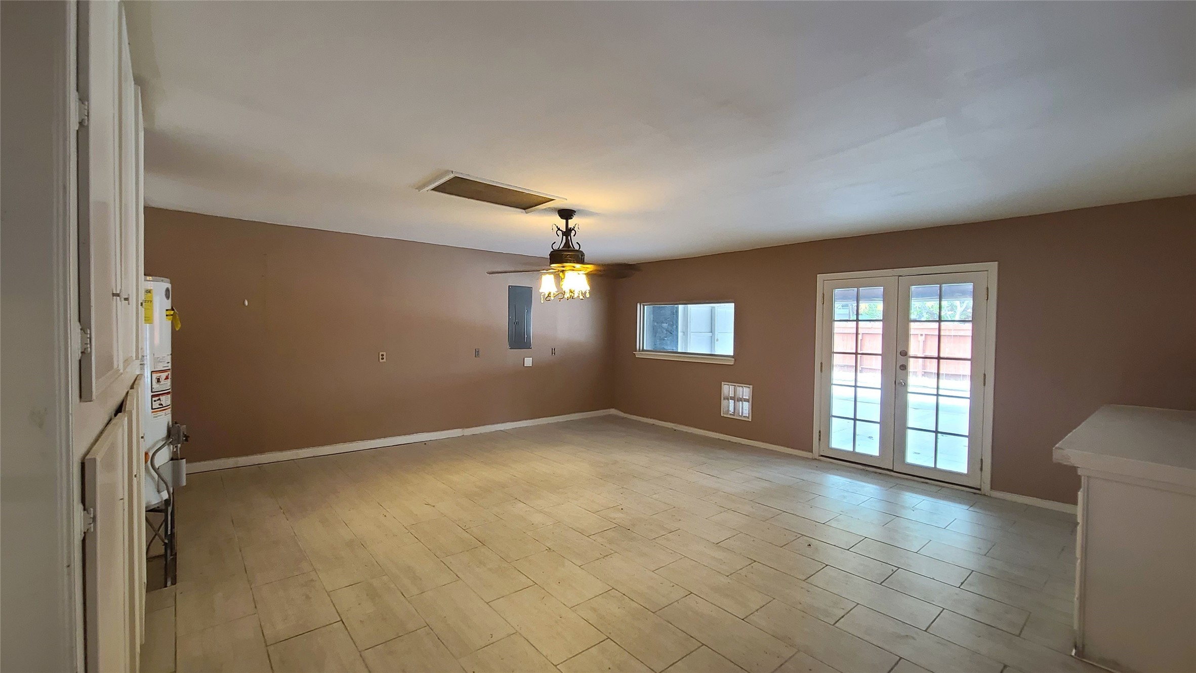 This extra room has a double doors lead to the car port