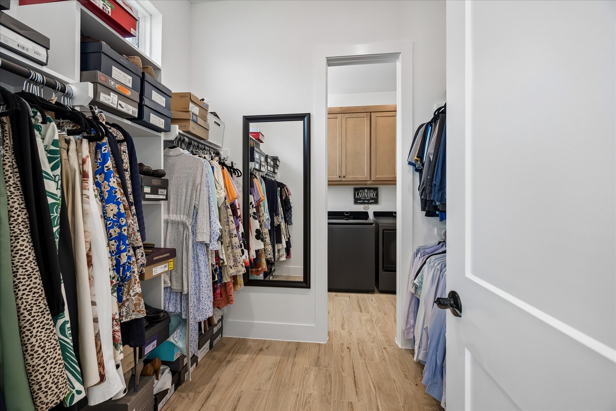 Convenient, direct access from the one of the primary closets to the spacious laundry room.