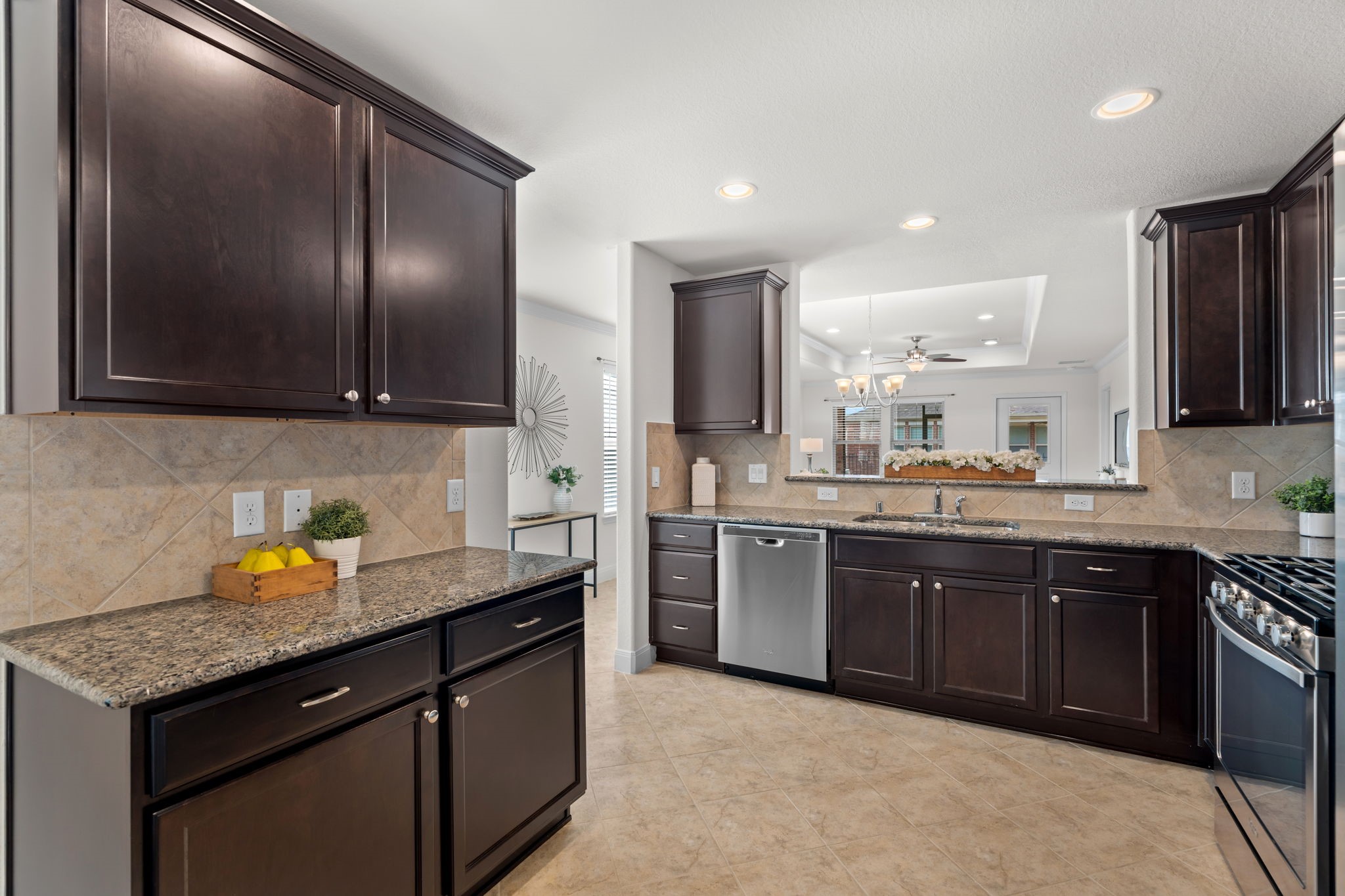 Welcoming kitchen features warm cabinetry & convenient everyday functionality!