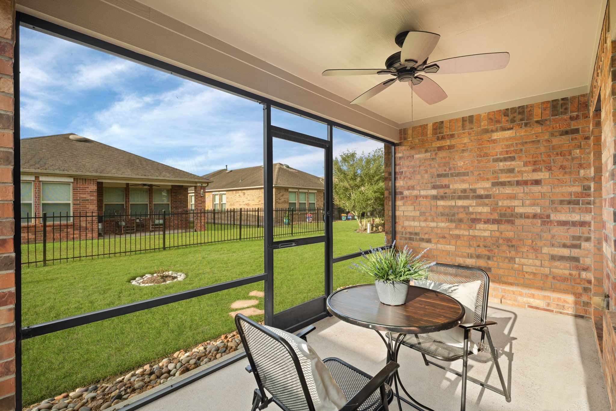 Screened-in patio invites you to relax & enjoy fresh air without pesky mosquitoes!