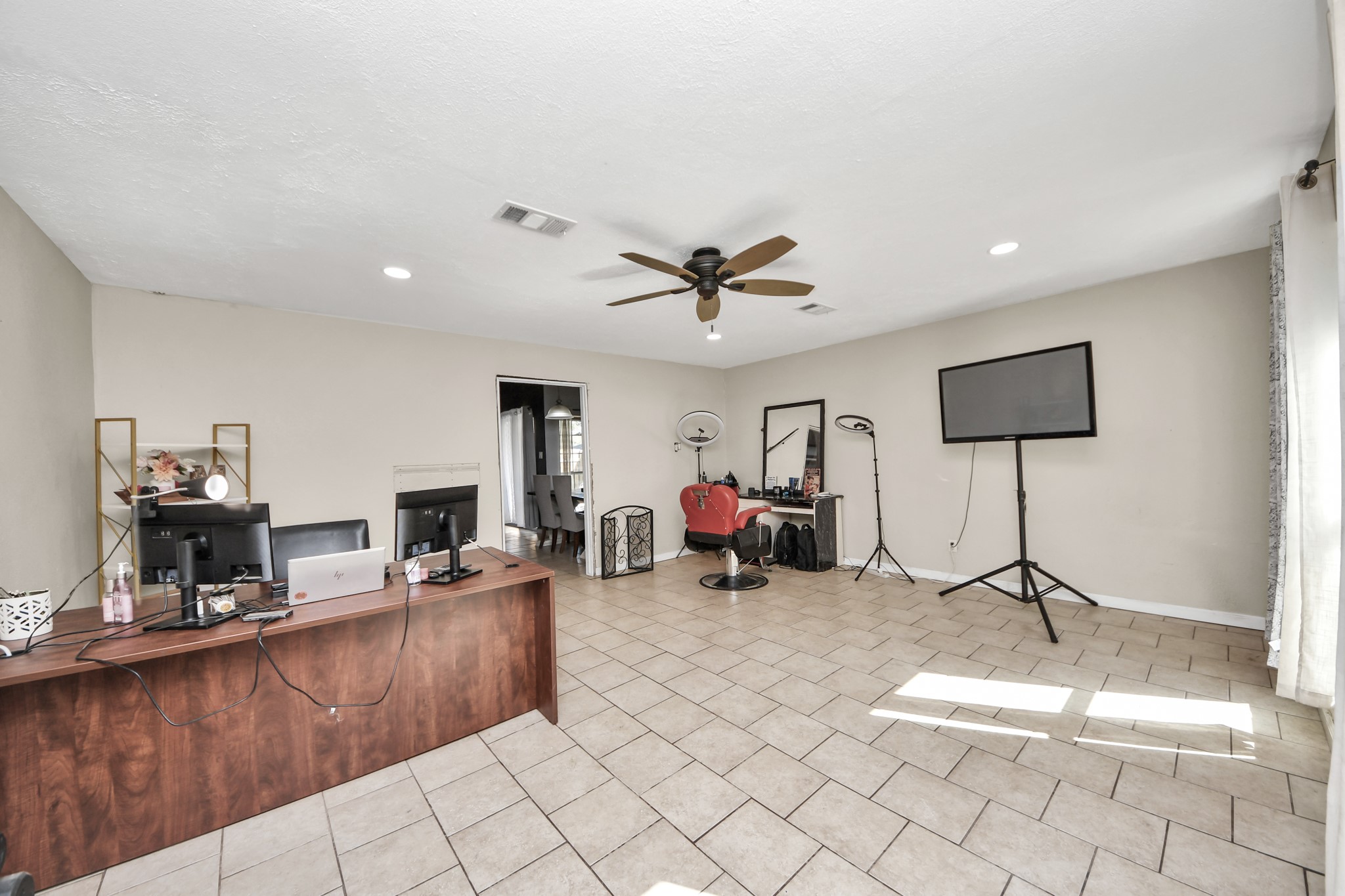 Expansive bonus room offering endless possibilities! Currently used as a home office and flex space, this versatile area features tile flooring, recessed lighting, a ceiling fan, and plenty of natural light. Easily transform it into a second living area, game room, media room, or entertainment space to fit your lifestyle!