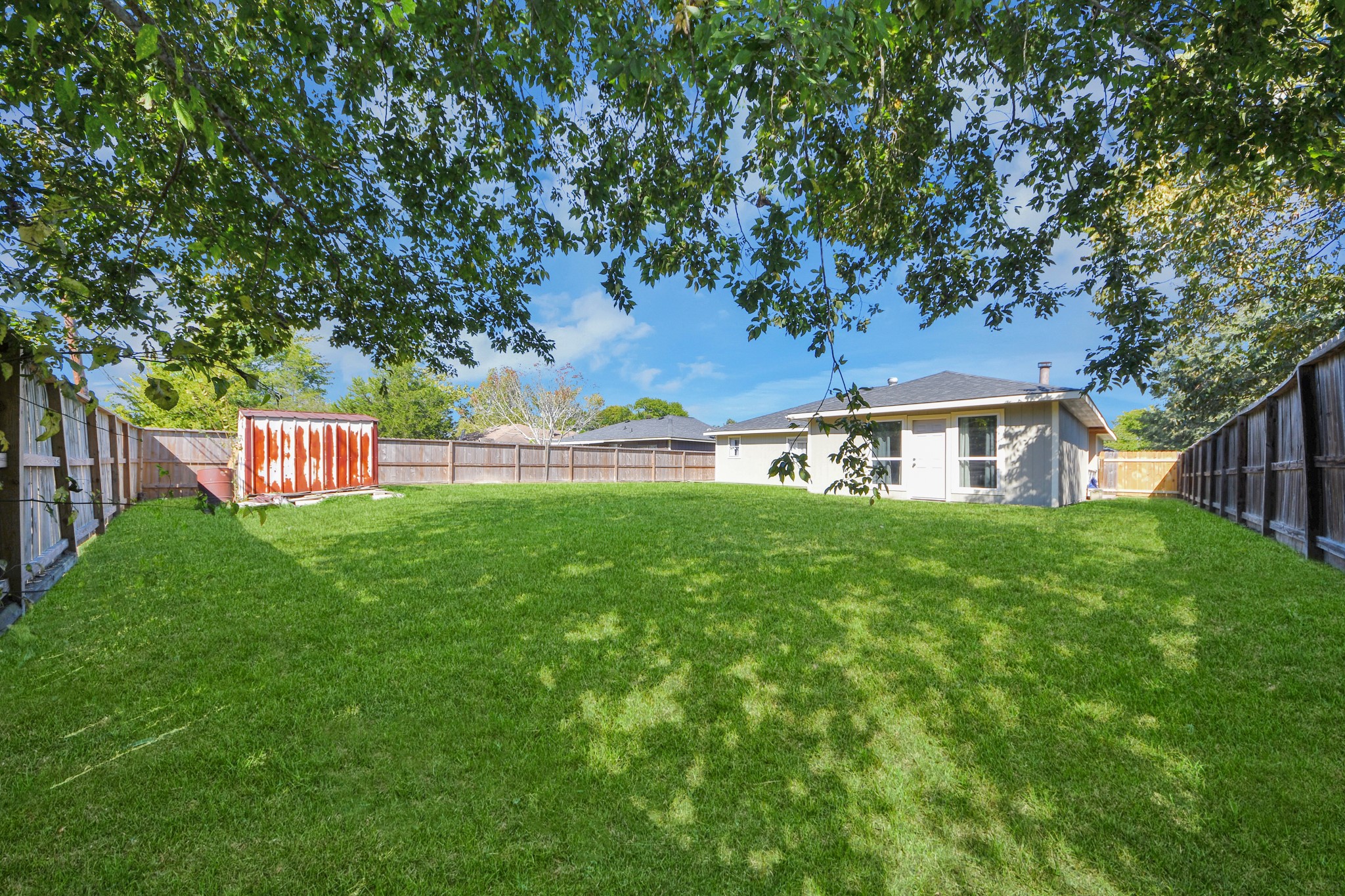Spacious backyard with endless possibilities! Plenty of room for outdoor activities, family gatherings, or entertaining. Create your dream outdoor retreat by adding a covered patio, outdoor kitchen, or expanding the existing outdoor living space.