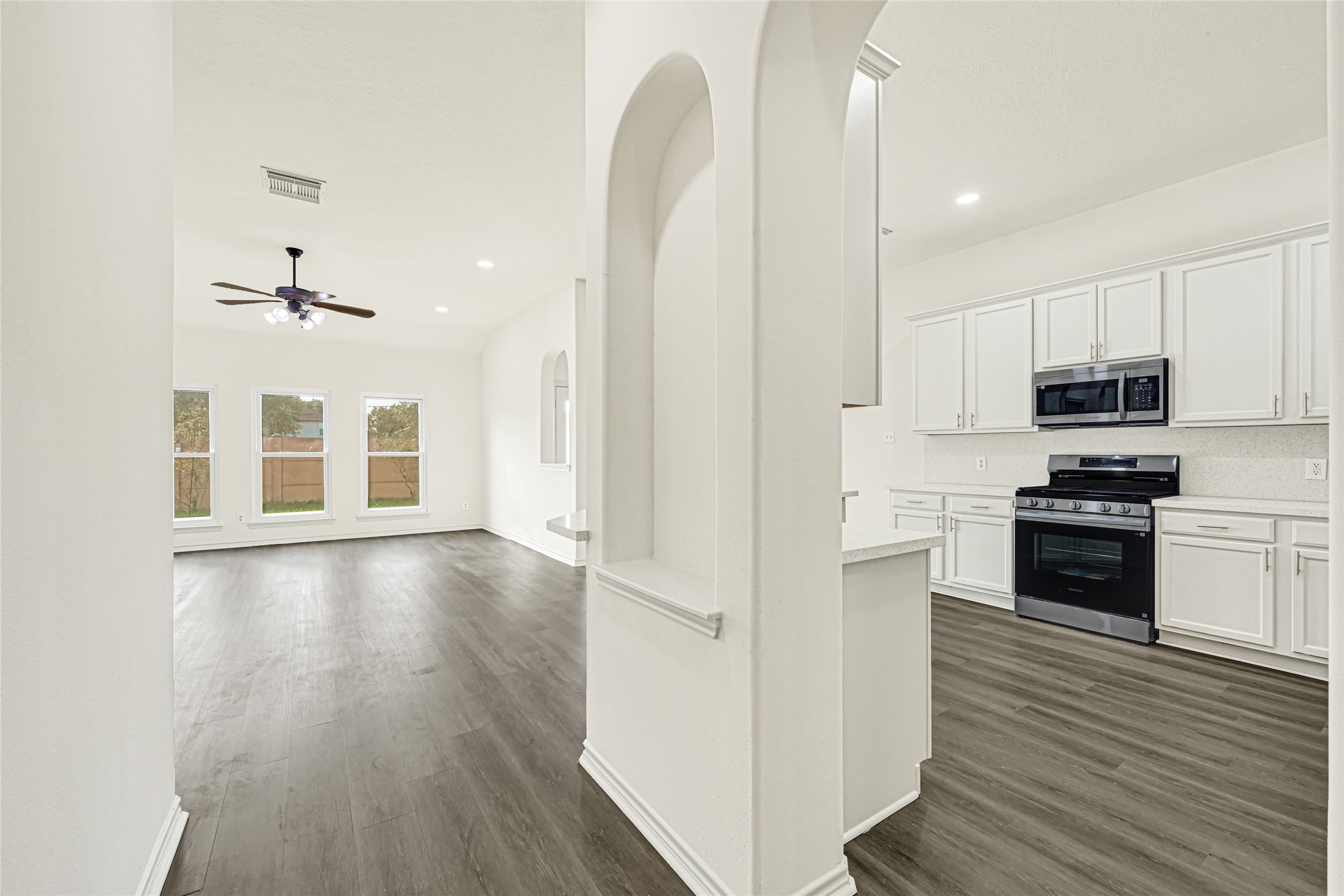 View of the kitchen and family room from main hallway