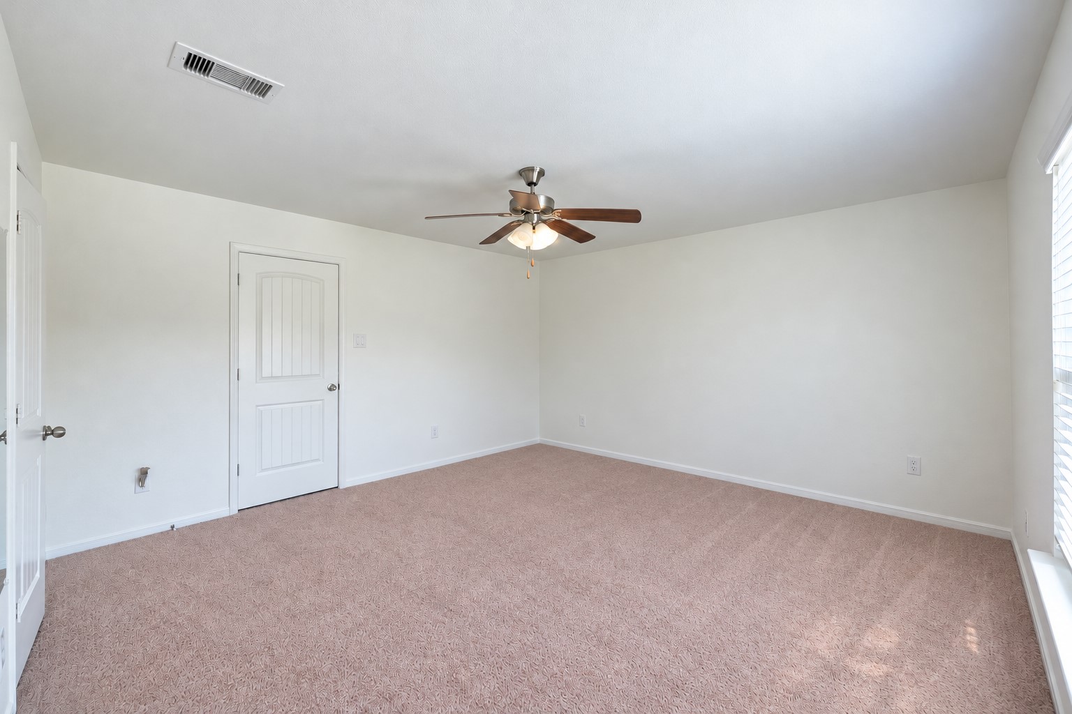 This photo has been digitally (un)staged (all furniture and decor removed) to show the potential of this additional room downstairs. | Curious how your furniture would look? Download this picture and take pictures of your current furniture and upload both into ChatGPT and ask it to stage the room using your furniture--it won't look exact but it can give you a great idea!