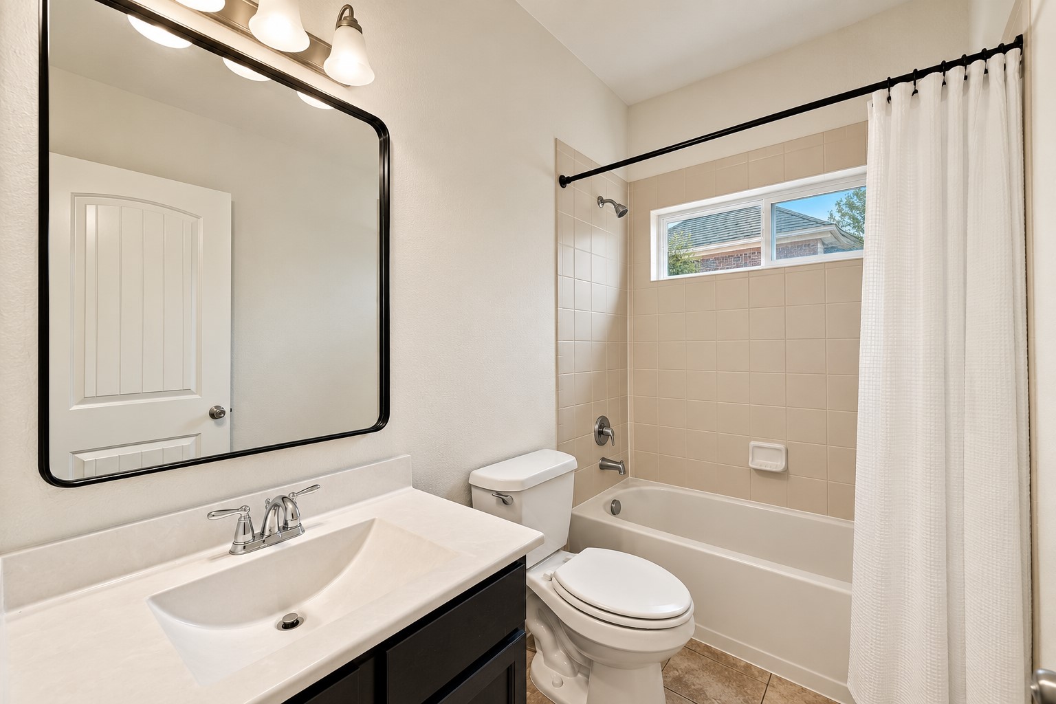 Directly between those two bedrooms a full bath.