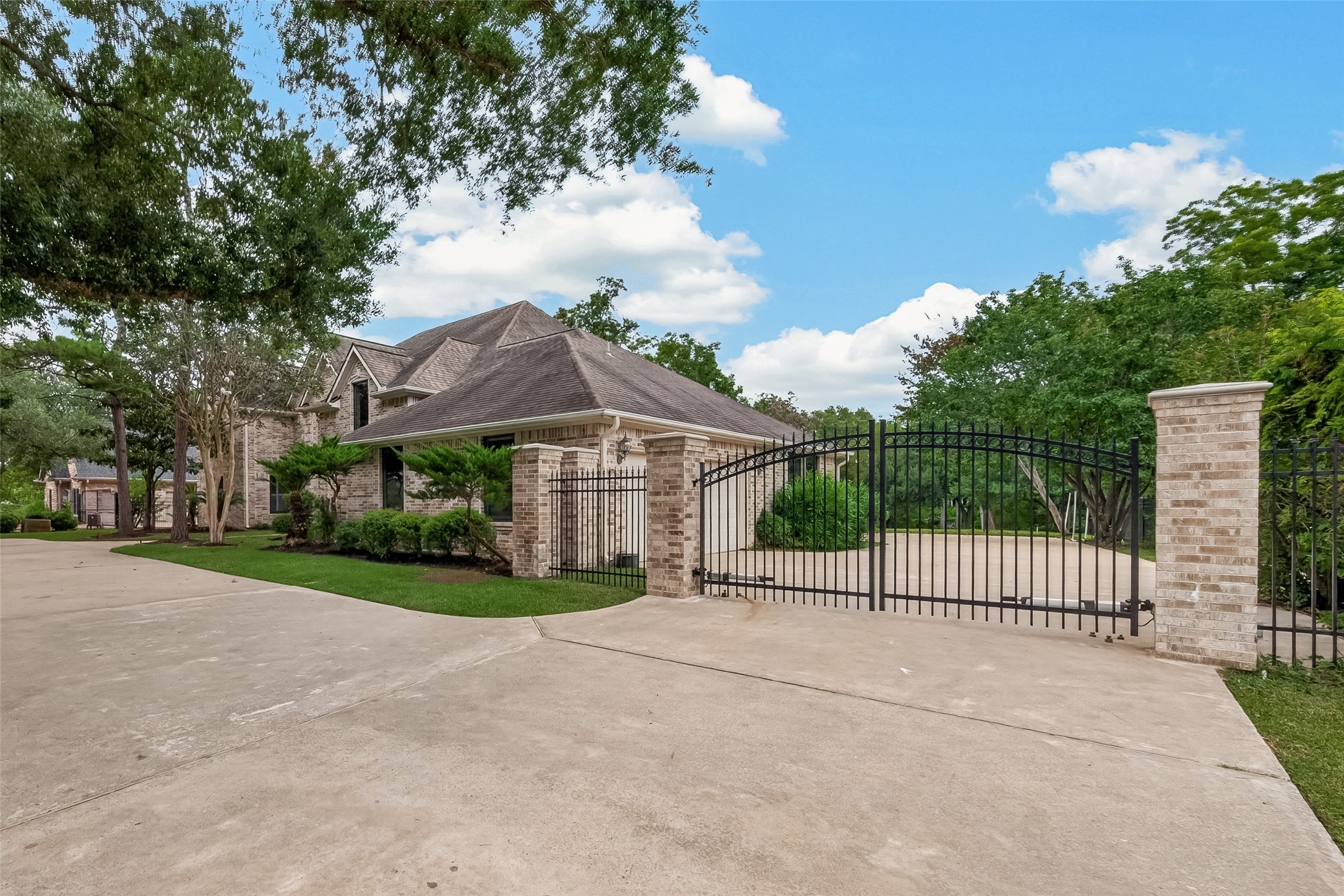 Automatic Gates lead to the motor court and garages.