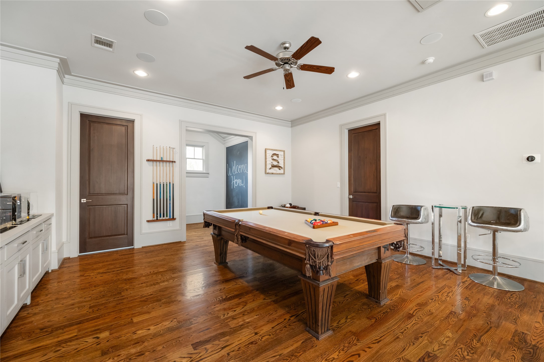 Enjoy entertaining and watching your favorite team in the game room with built-ins for additional storage