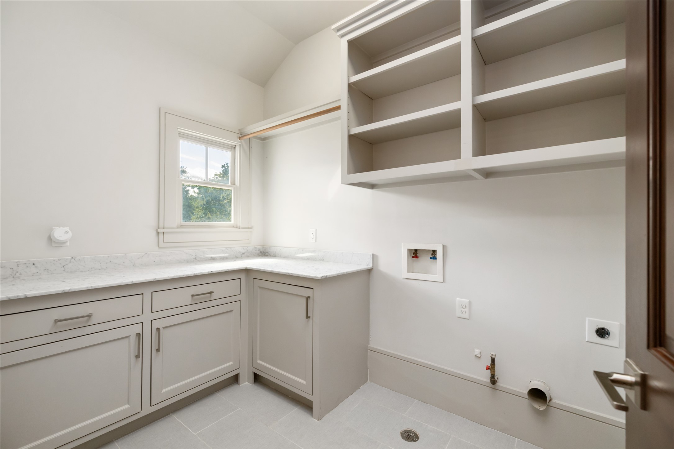 The large laundry room services the upstairs bedrooms