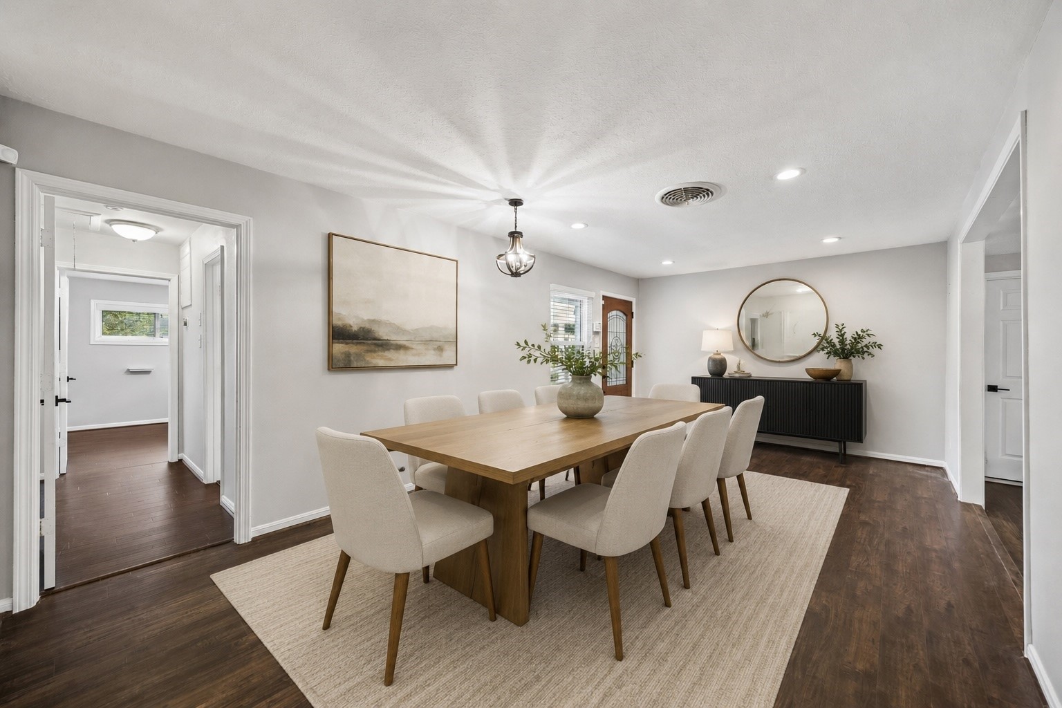 Gather with ease in this beautifully staged dining room, where generous proportions create the perfect setting for everyday meals and memorable celebrations. Warm wood tones, soft neutral finishes, and an open connection to the adjacent living spaces make entertaining feel effortless. **Virtually staged** Gather with ease in this beautifully staged dining room, where generous proportions create the perfect setting for everyday meals and memorable celebrations. Warm wood tones, soft neutral finishes, and an open connection to the adjacent living spaces make entertaining feel effortless. **Virtually staged**