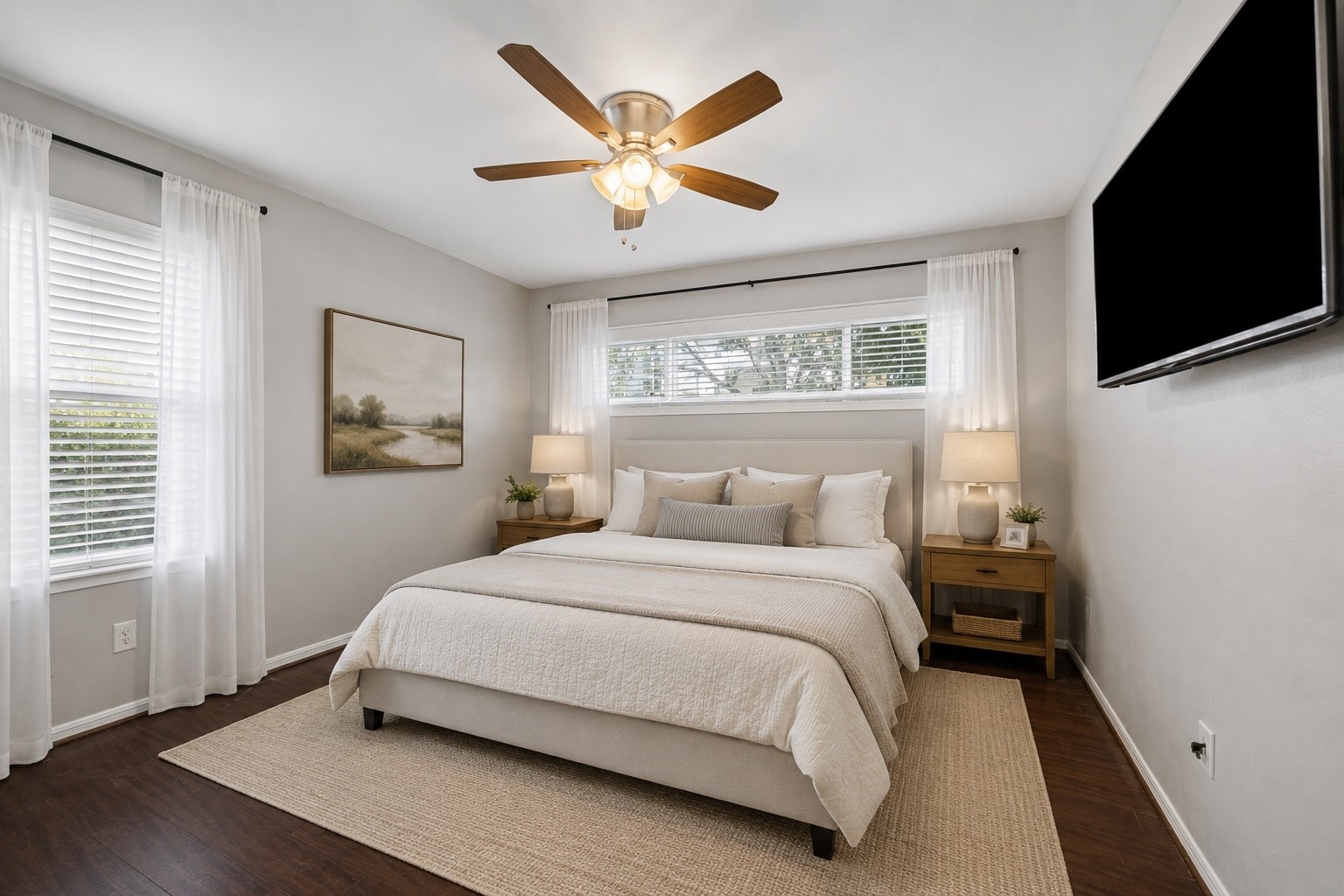 A calming retreat awaits in the spacious primary bedroom, where soft neutral finishes and abundant natural light create a relaxing atmosphere. **Virtually staged** A calming retreat awaits in the spacious primary bedroom, where soft neutral finishes and abundant natural light create a relaxing atmosphere. **Virtually staged**