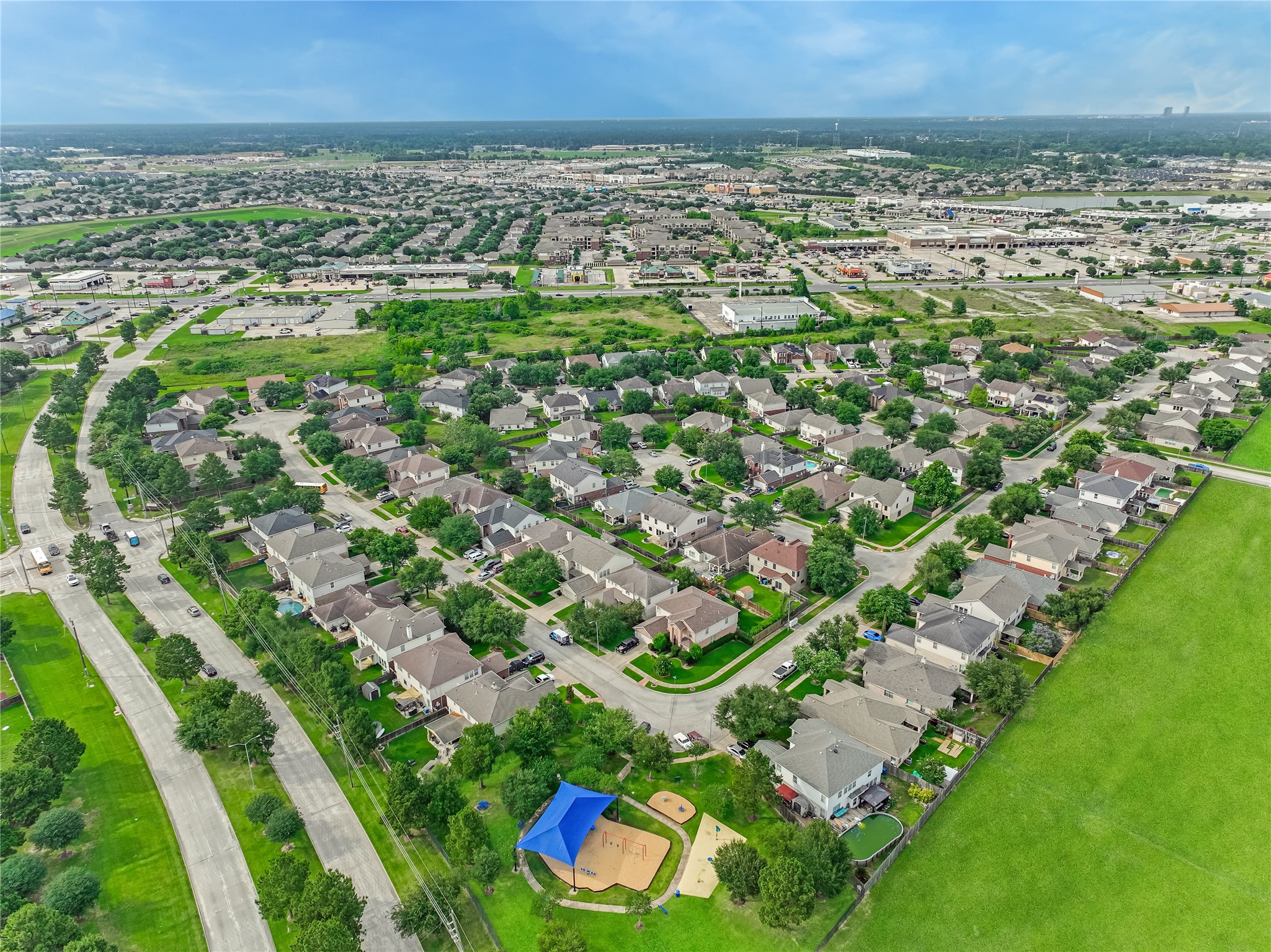 High-altitude aerial view of the residential neighborhood, surrounding homes, and streets.