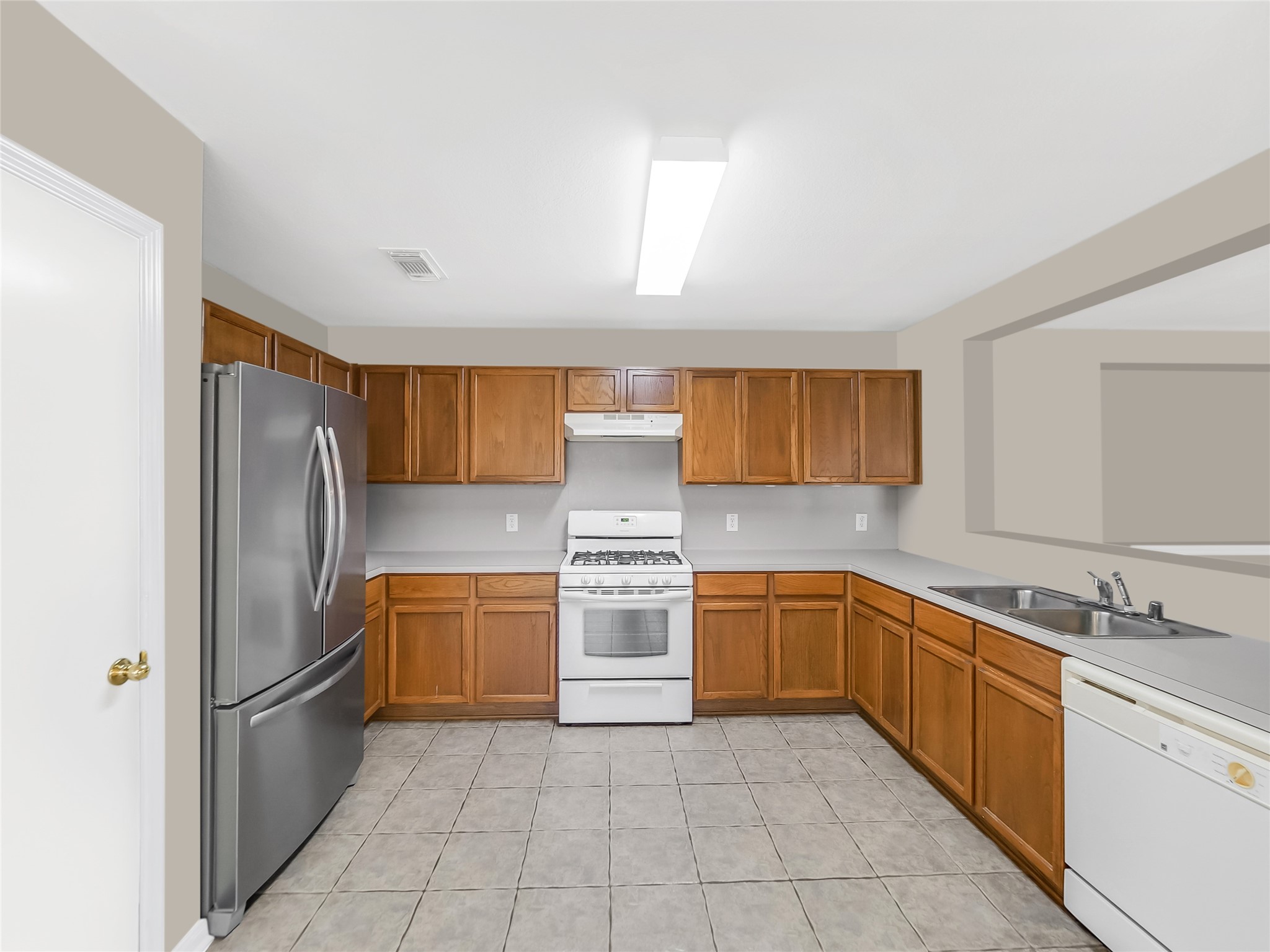 Kitchen adjacent to living space.