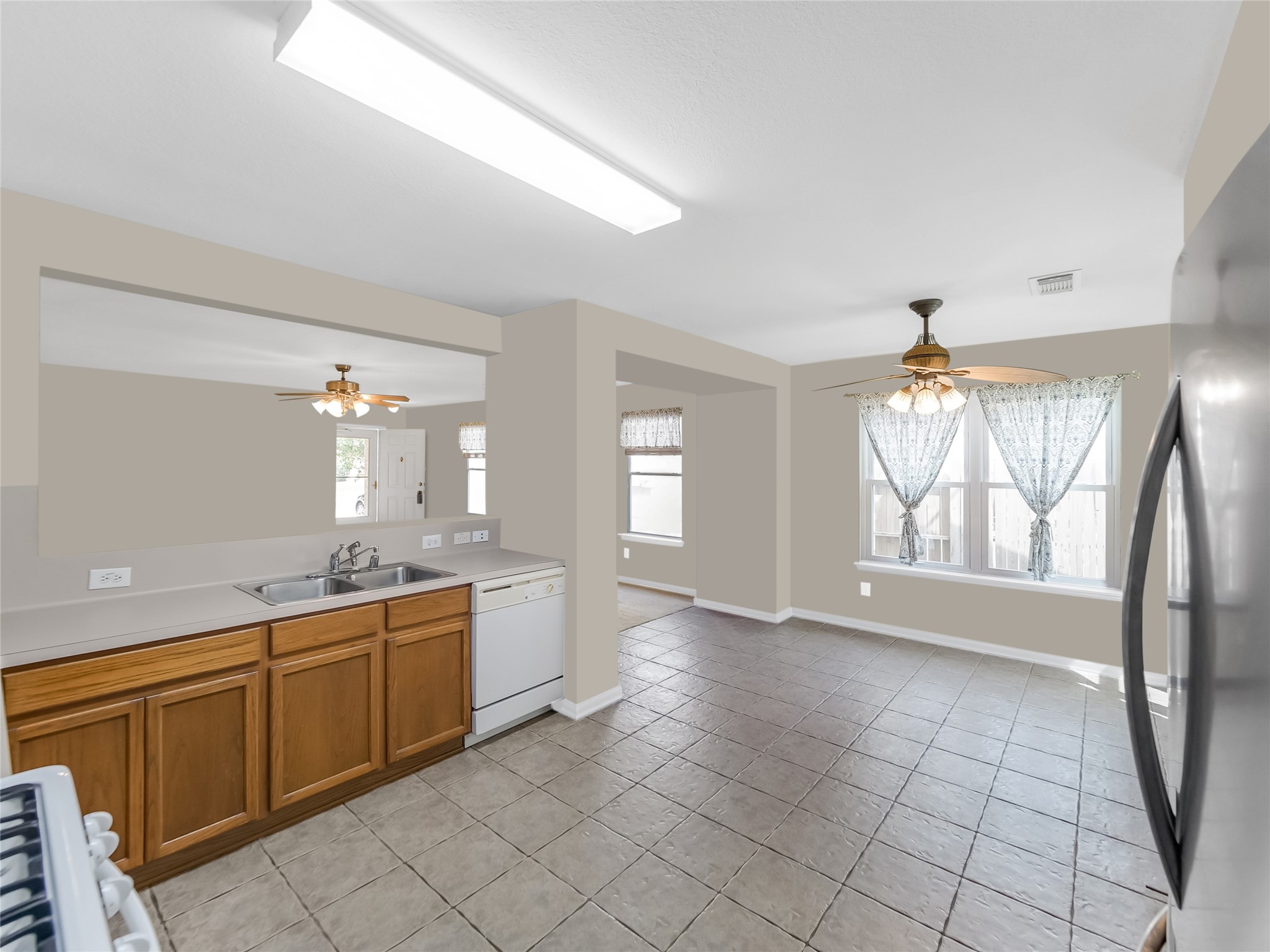 Spacious kitchen with ample cabinet storage.