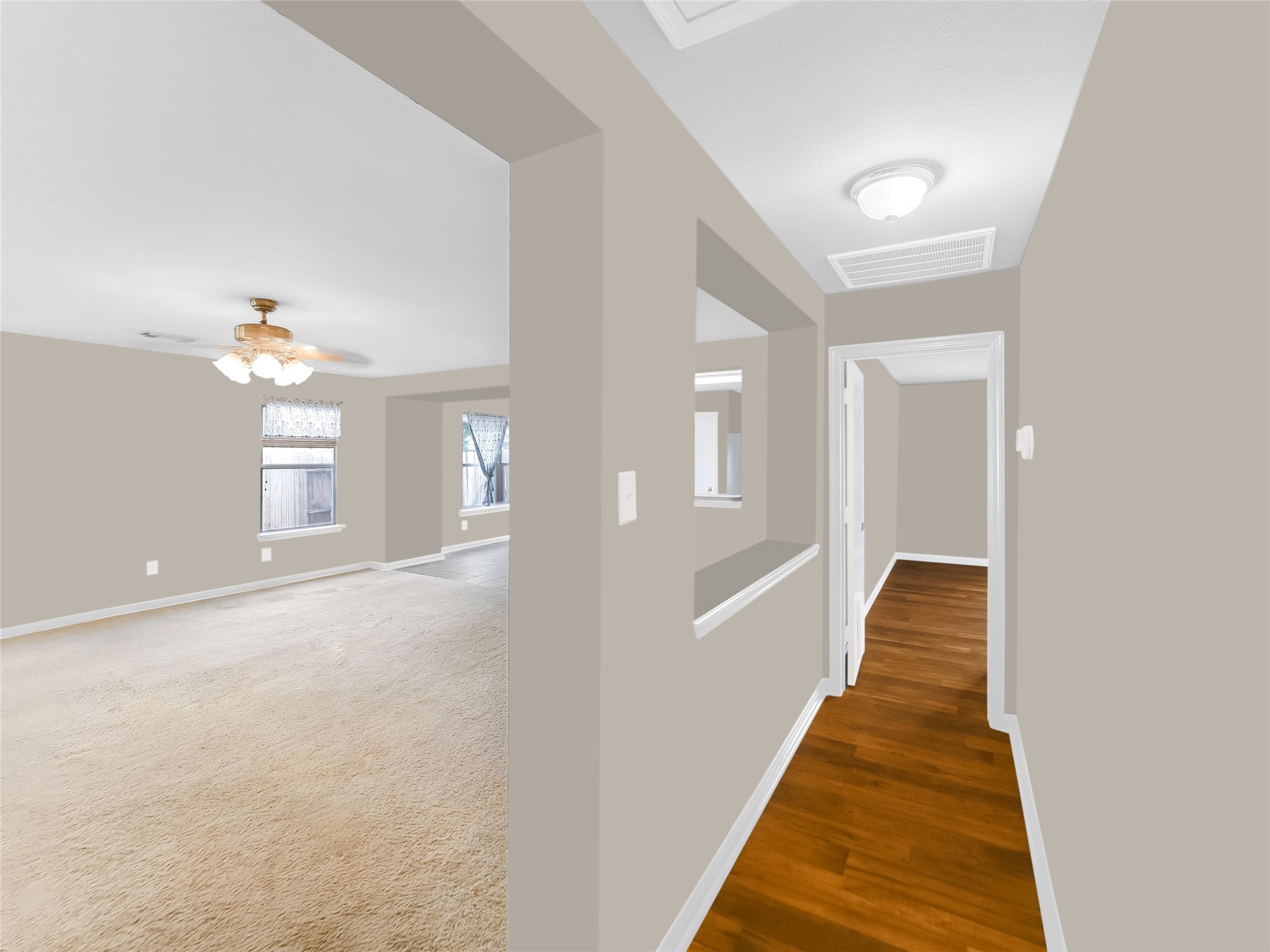 Interior hallway with open view into adjoining rooms.
