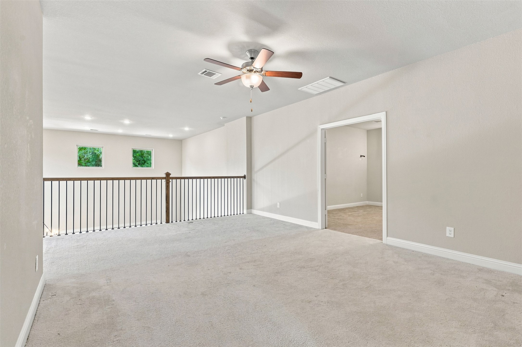 Large upstairs game room overlooking the living room below.