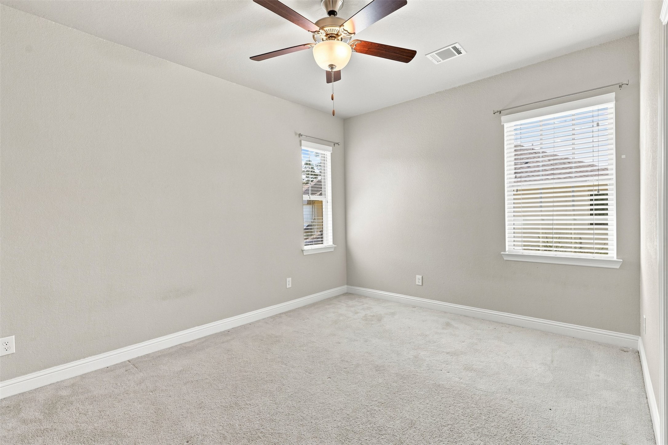 One of the secondary bedrooms with a full ensuite bath.