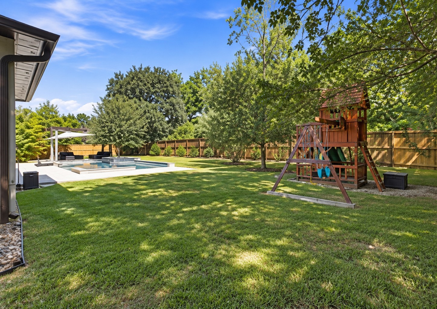 An impressive outdoor oasis offers plenty of space to entertain, unwind, and enjoy everything this backyard has to offer.