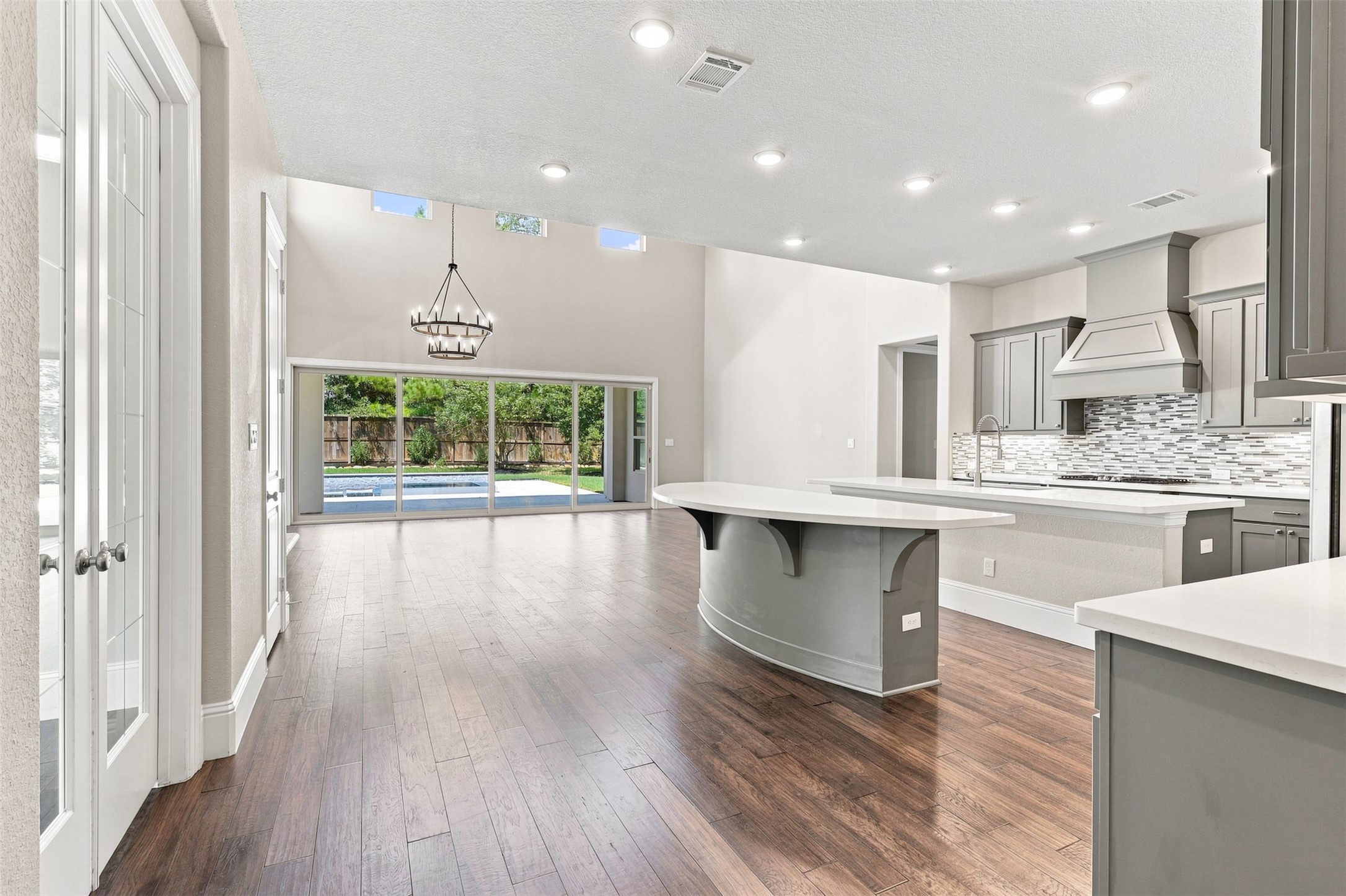 French doors to the private study and open views into the home's main living areas.