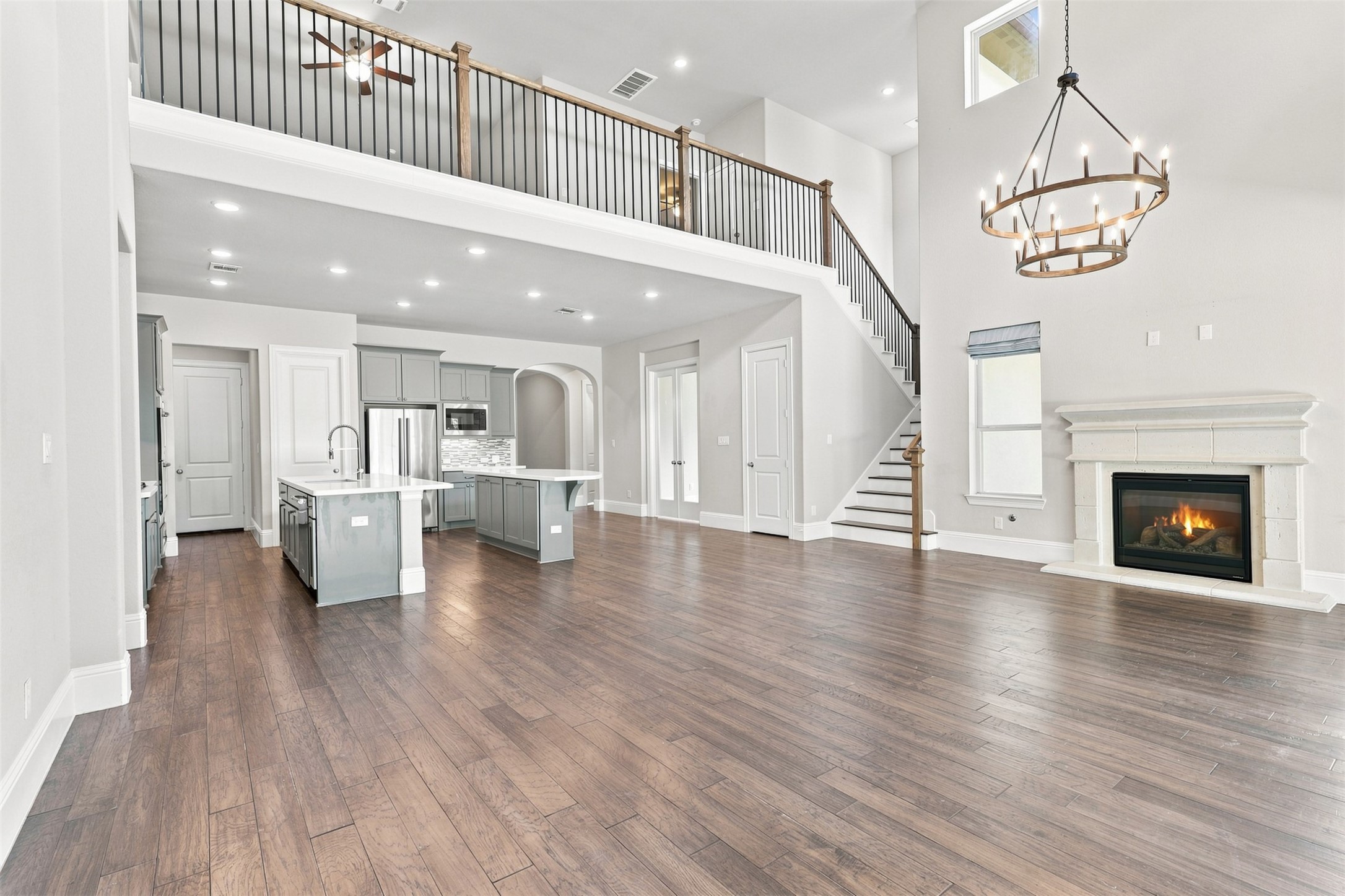Full view of the living room into the upstairs game room.