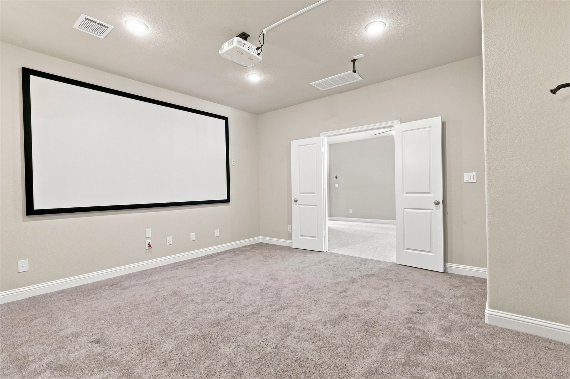 The media room includes projector and screen.