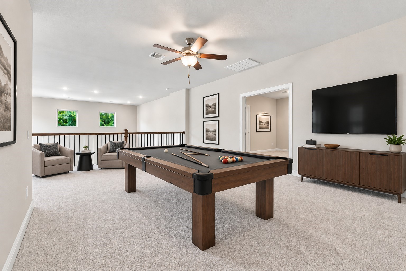Spacious game room upstairs that is great for entertaining. VIRTUALLY STAGE: