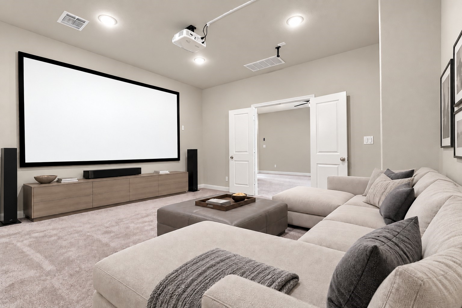 Dedicated media room featuring a projector and screen, creating the perfect space for movie nights, game days, and at-home entertainment. VIRTUALLY STAGED