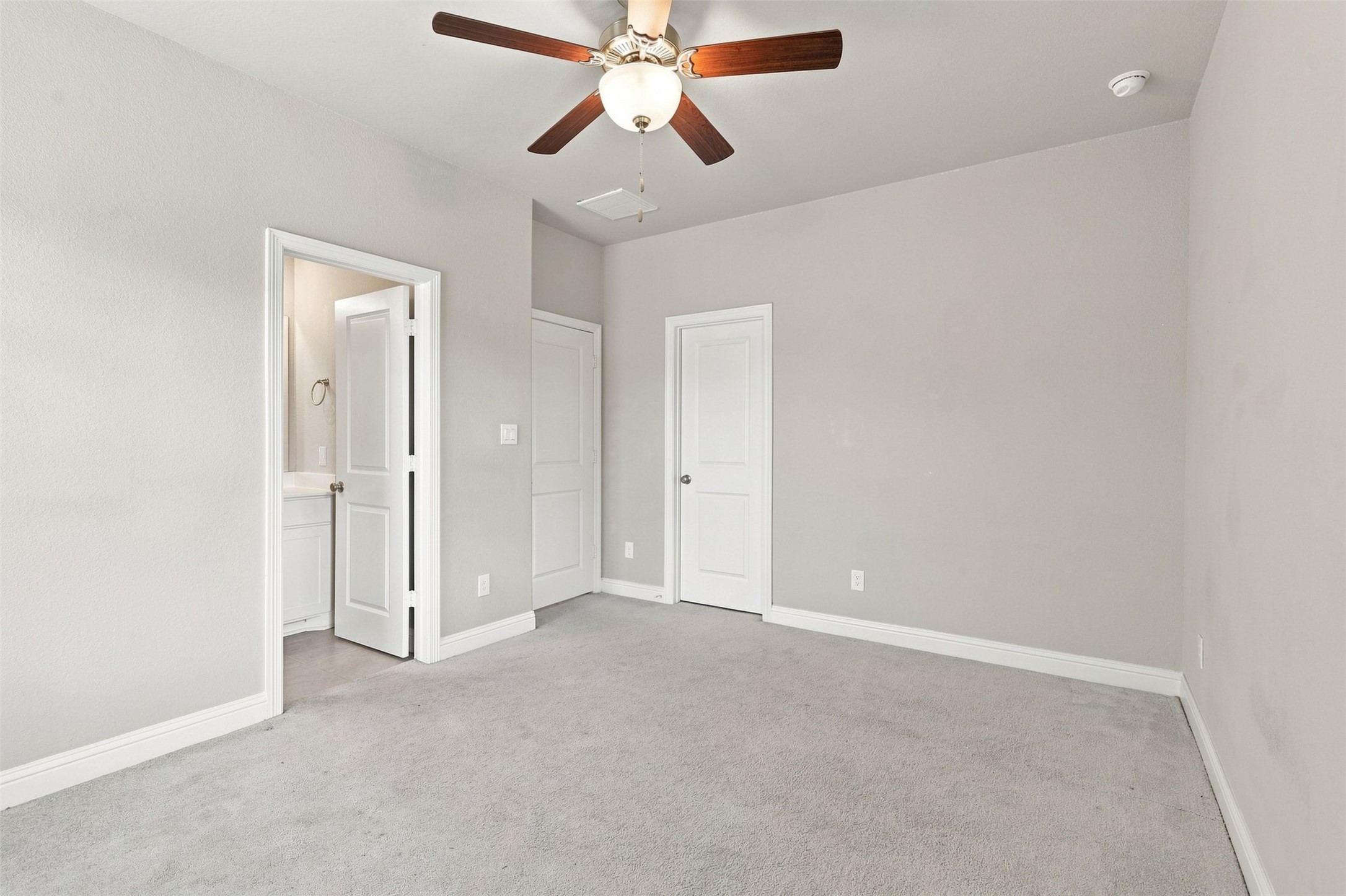 One of the secondary bedrooms with a full ensuite bath.