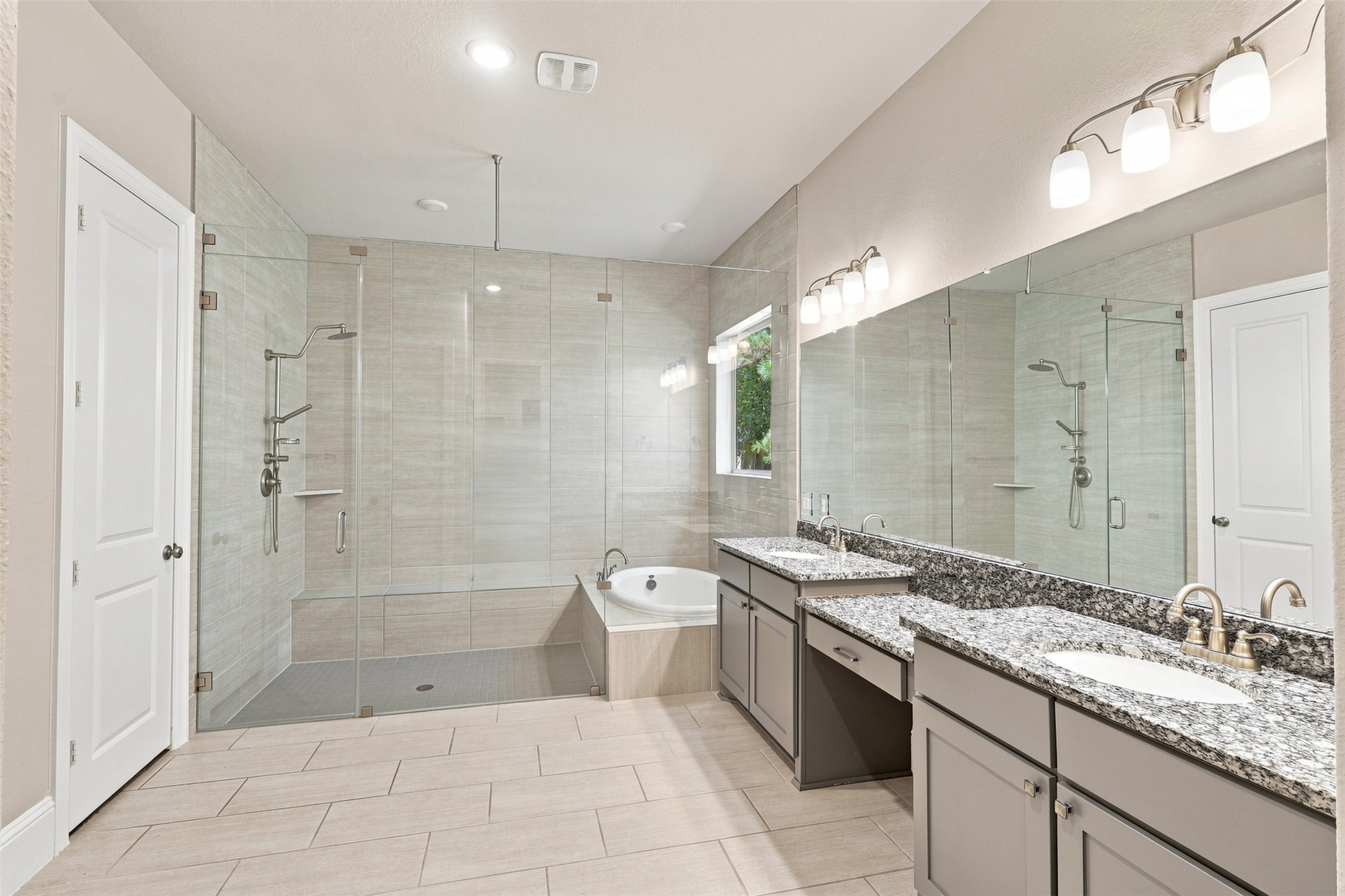 Inviting primary bath features a spacious layout designed with comfort and convenience in mind.