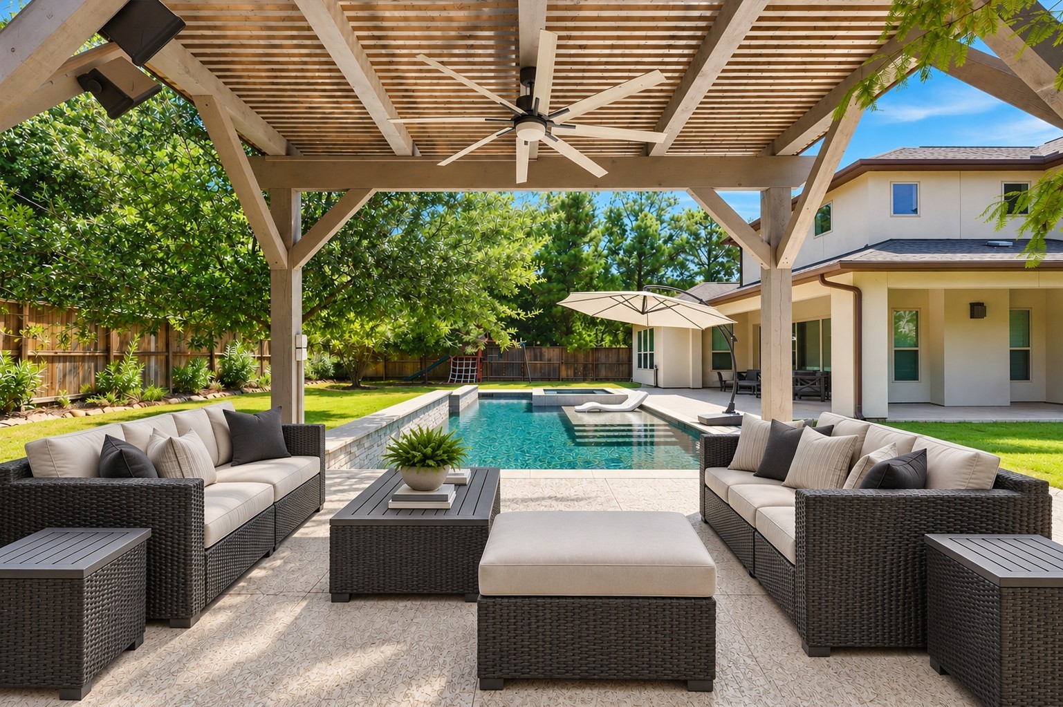 Inviting outdoor living space with covered pergola, sparkling pool, and beautifully landscaped backyard.