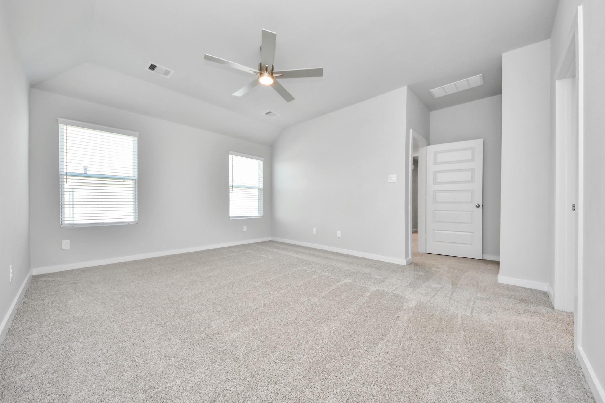 Another perspective unveils a comprehensive view of the serenity and comfort this primary suite offers. Sample photo of completed home with similar floor plan. Actual colors and selections may vary.