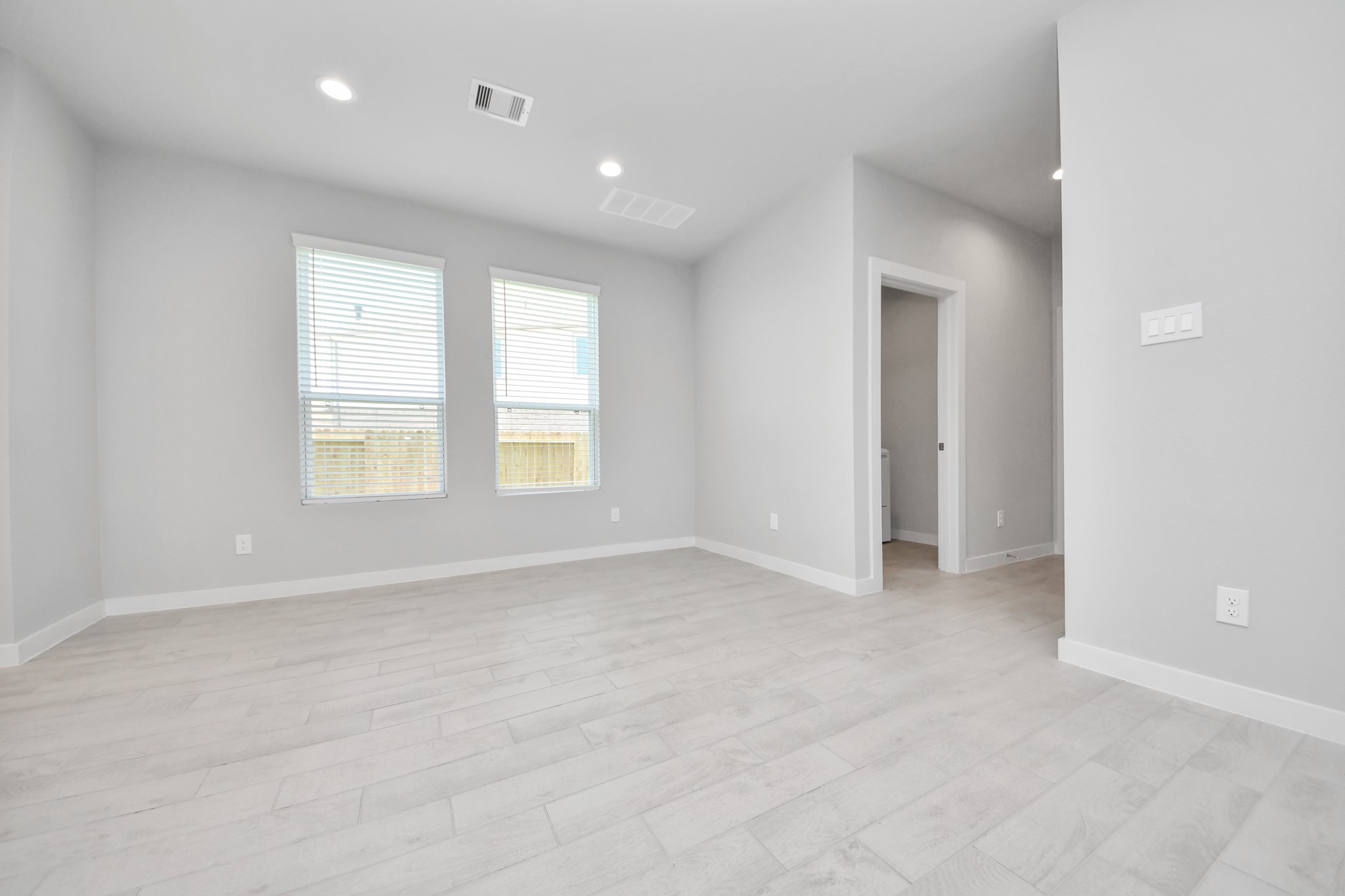 Make memories gathered around the table with your family and friends! This spacious dining room features elegant flooring, custom paint, and adjacent to family room and kitchen for open concept feel. Sample photo of completed home with similar floor plan. Actual colors and selections may vary.