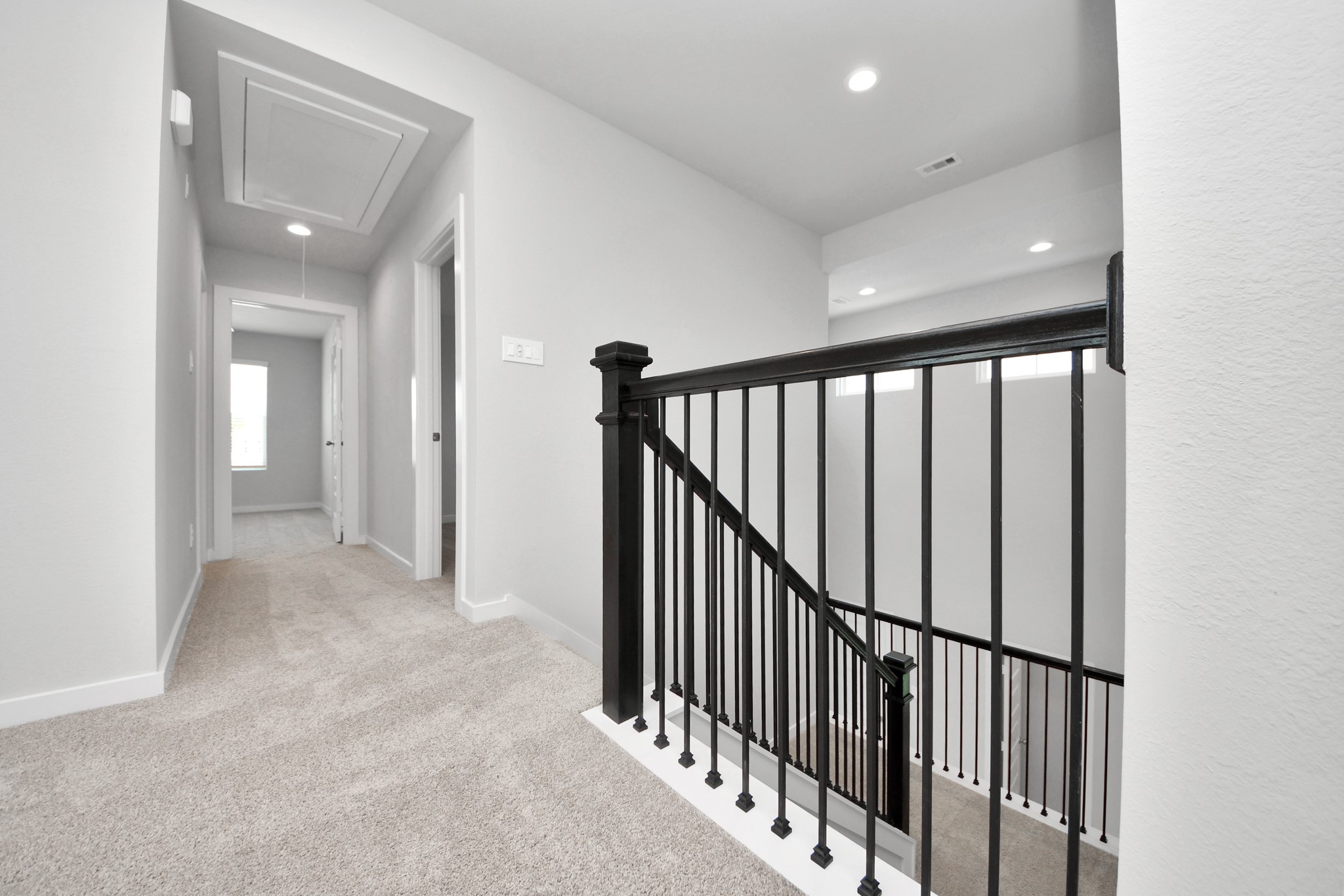 Ascend to relaxation in this fantastic game room! Ideal for both casual gatherings and adult gaming, it boasts plush carpet, lofty ceilings, custom paint, and ample windows for abundant natural light. Sample photo of completed home with similar floor plan. Actual colors and selections may vary.