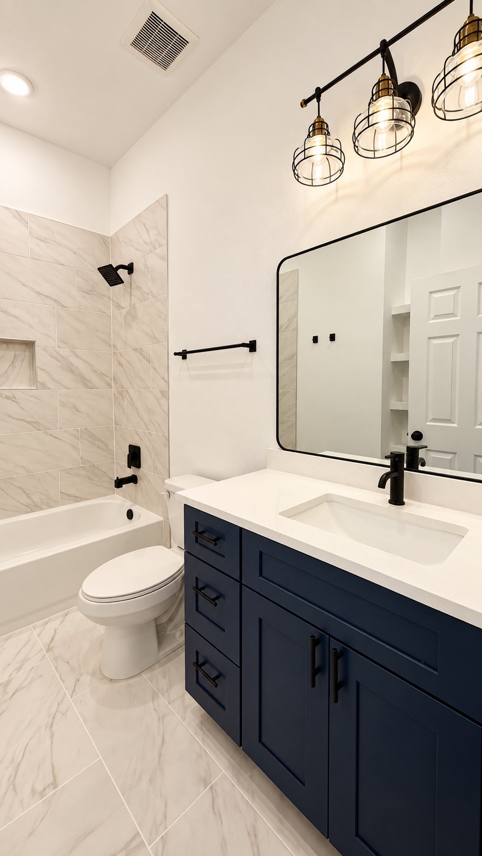 Modern primary bathroom featuring a spacious bathtub, stylish finishes, and a contemporary design.