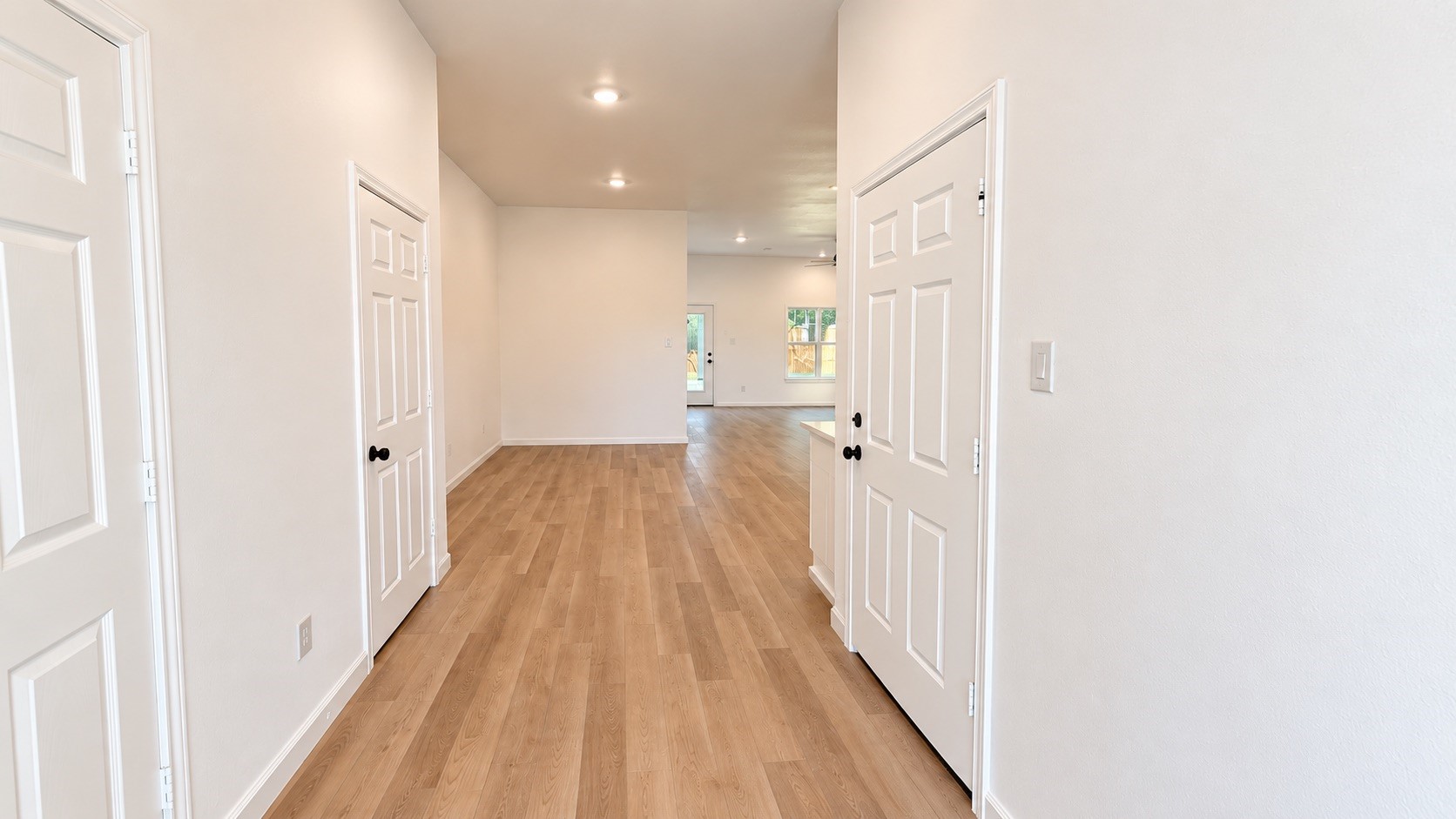Spacious entryway featuring soaring high ceilings and a welcoming design.