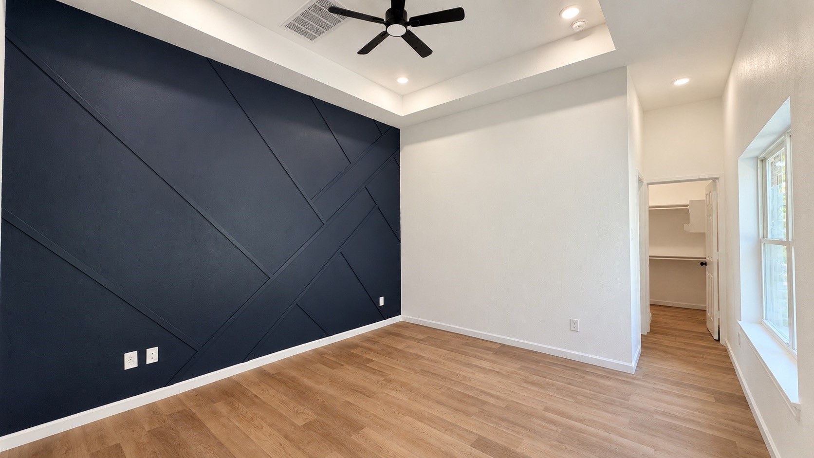 Spacious Primary Bedroom with Custom Accent wall