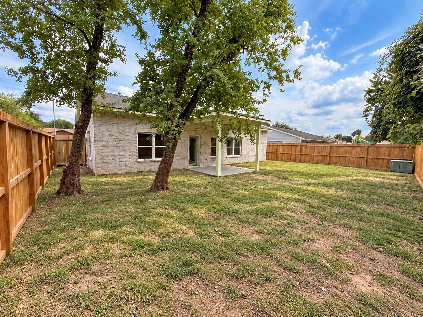 The backyard is currently undergoing landscaping and sodding.