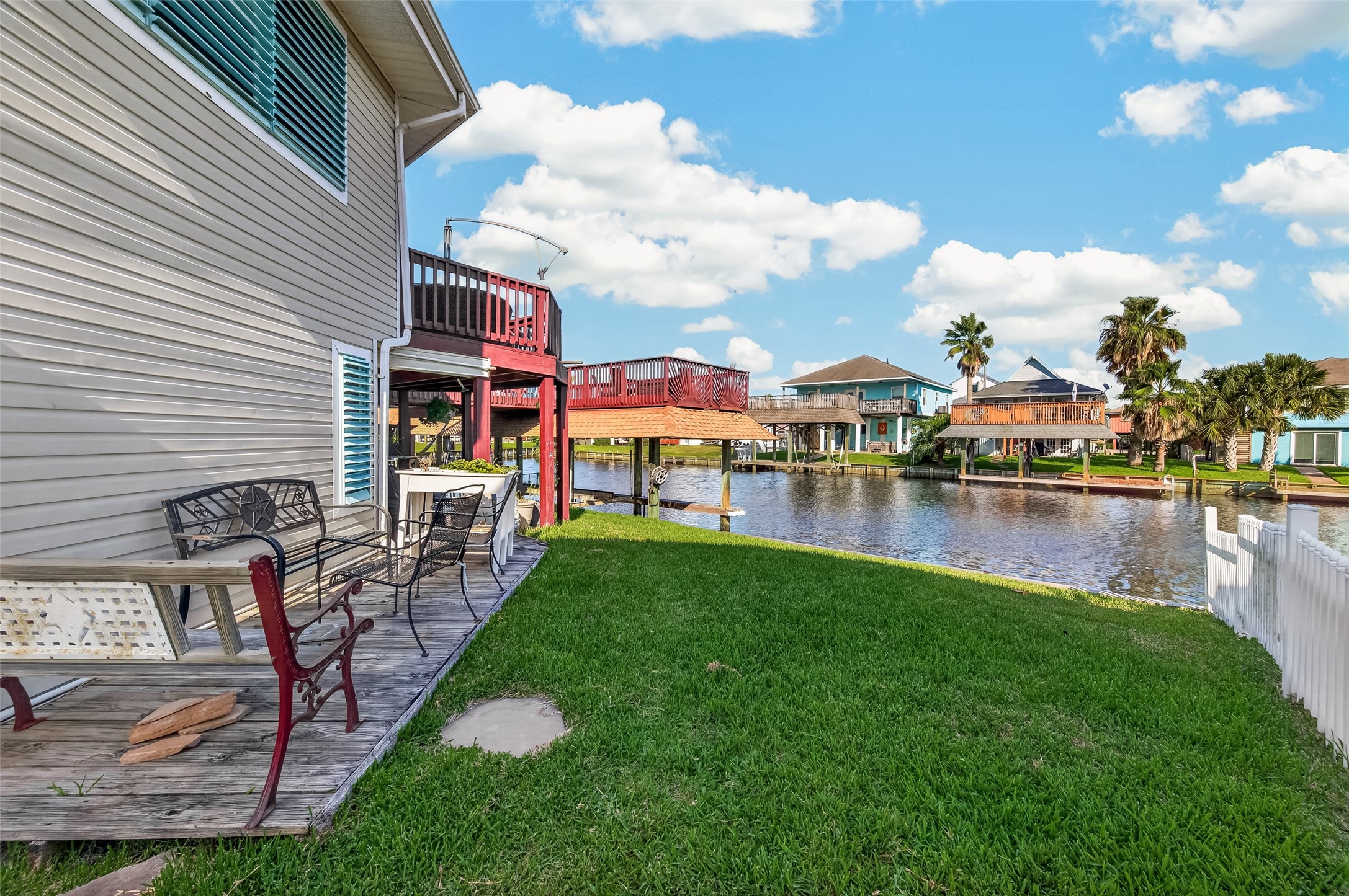 Sun-drenched waterside relaxation at its finesta dedicated side deck right by a stretch of grass with lovely coastal views.
