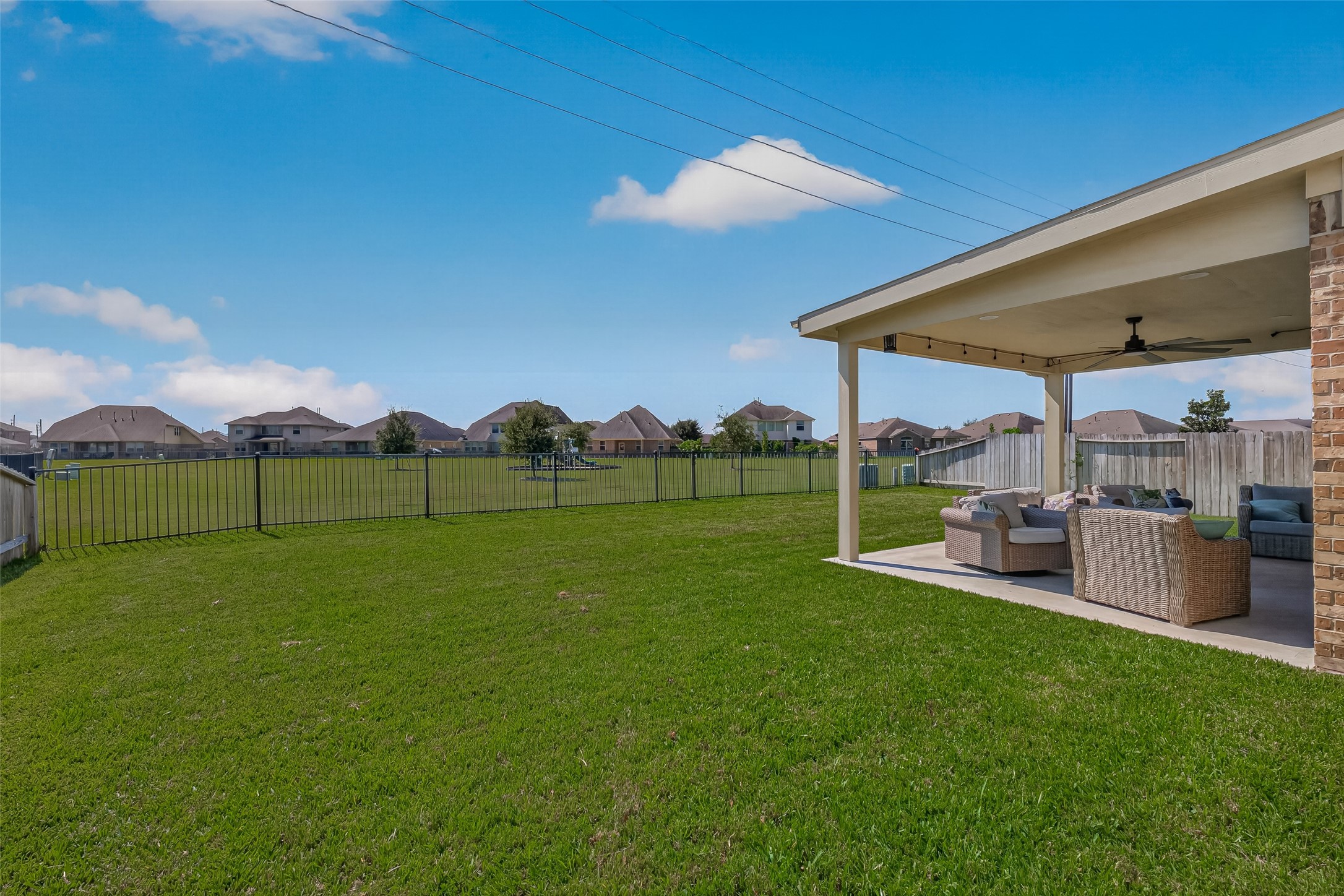 A fenced backyard and covered patio provide room to enjoy the outdoors at 6111 Wayne Way.