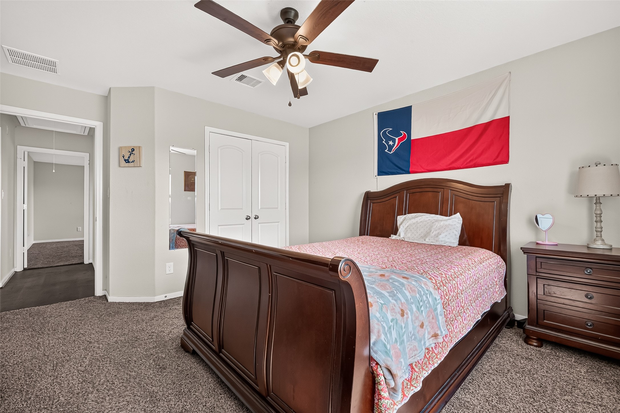 Another view of an upstairs bedroom with convenient access to its adjoining spaces.