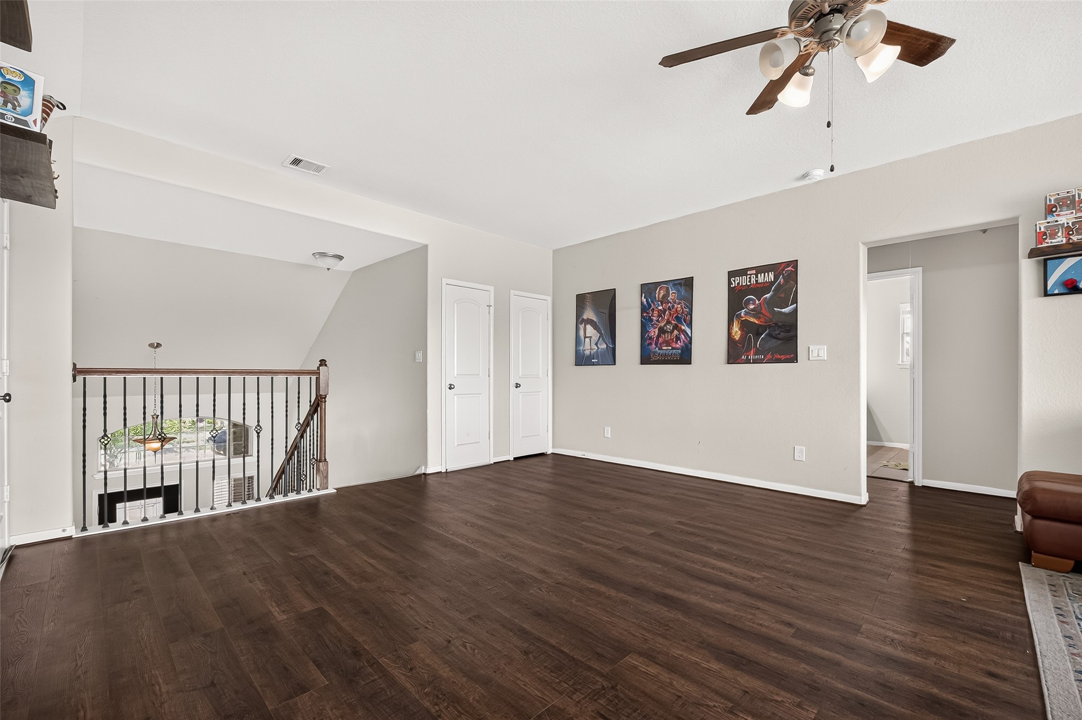 The upstairs game room offers generous space and luxury vinyl plank flooring.