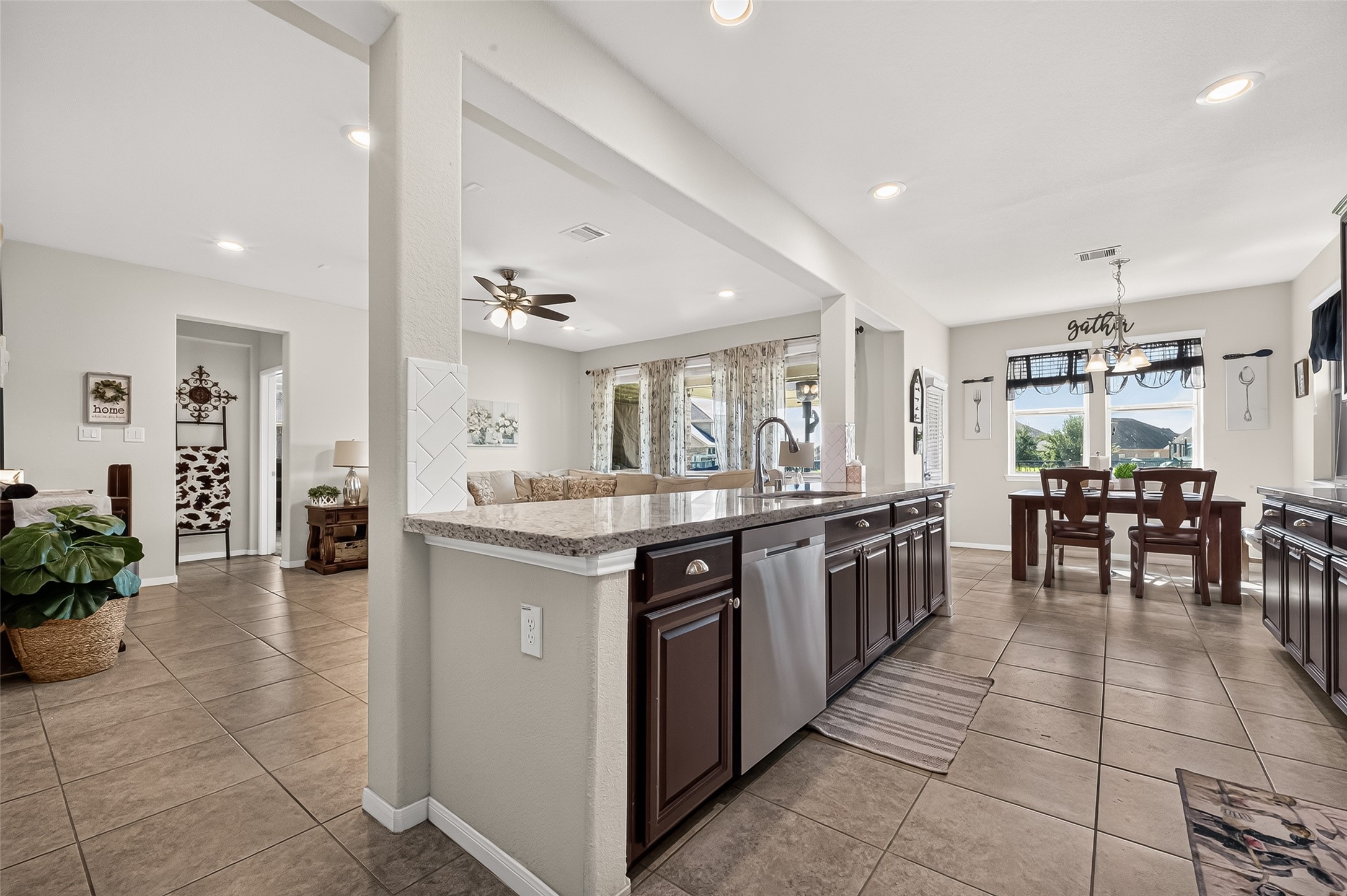 An extended breakfast bar connects the kitchen with the home's open living spaces.